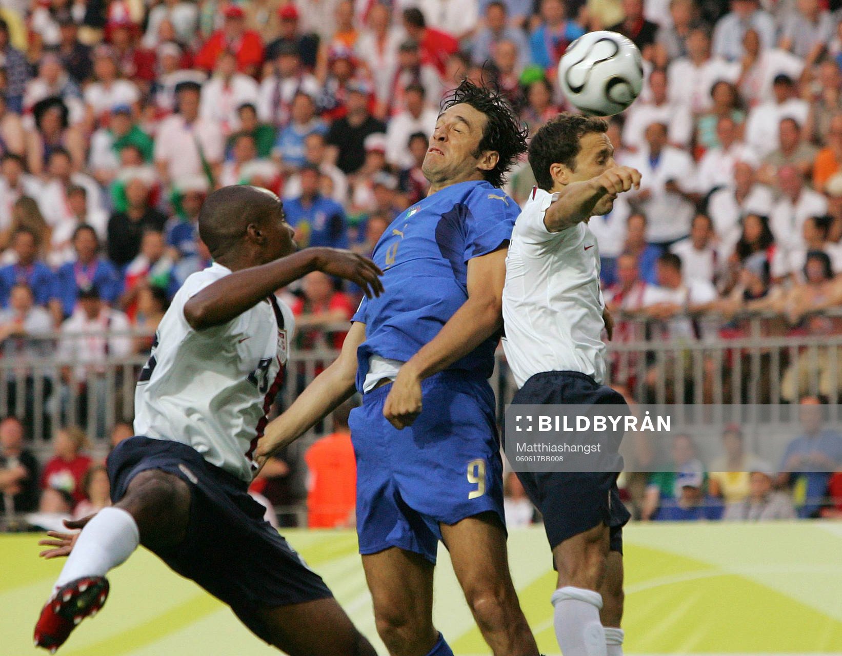 Eddie Pope, Luca Toni, Italien och Steve Cherundolo, USA