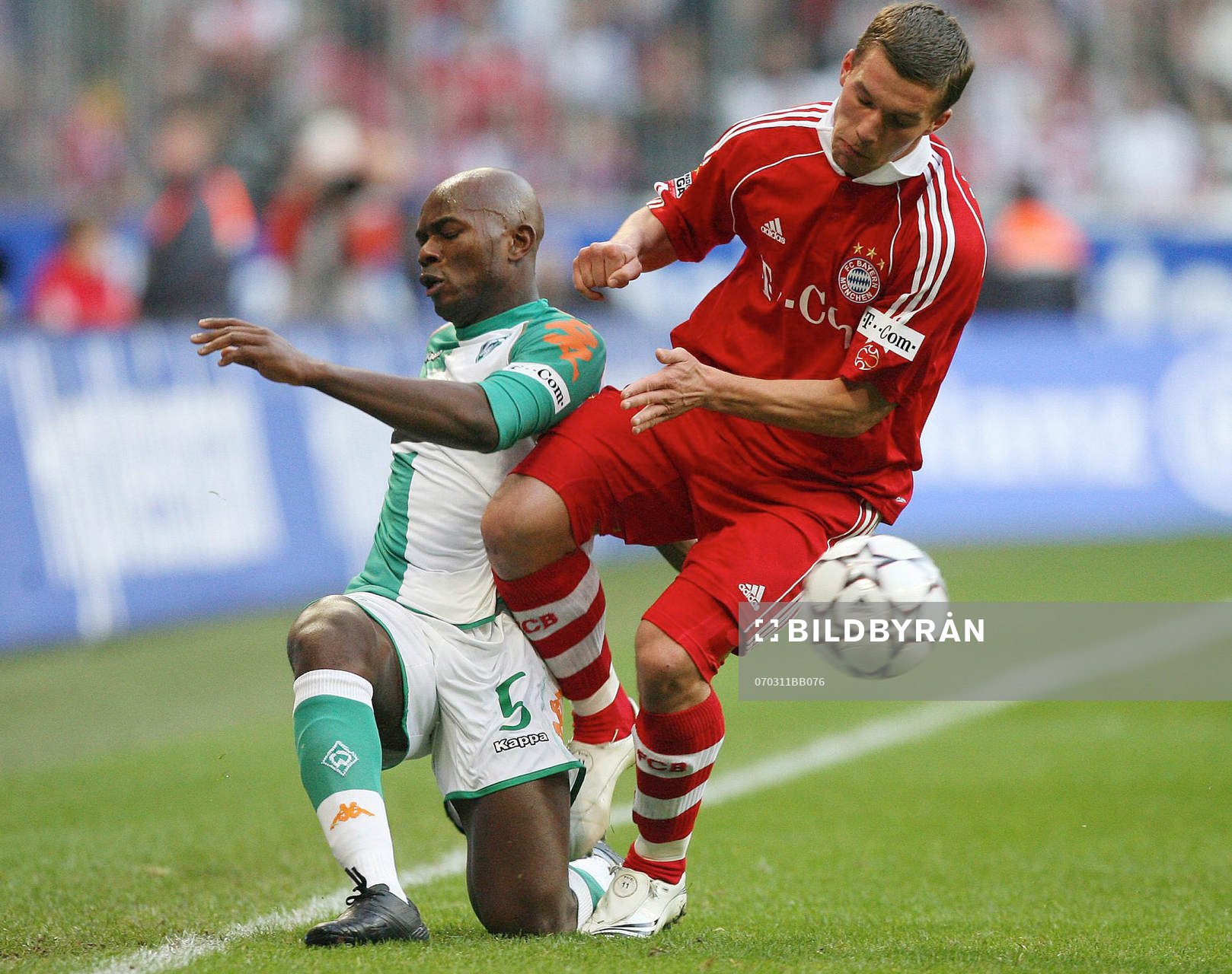   Pierre Wome och Lukas Podolski