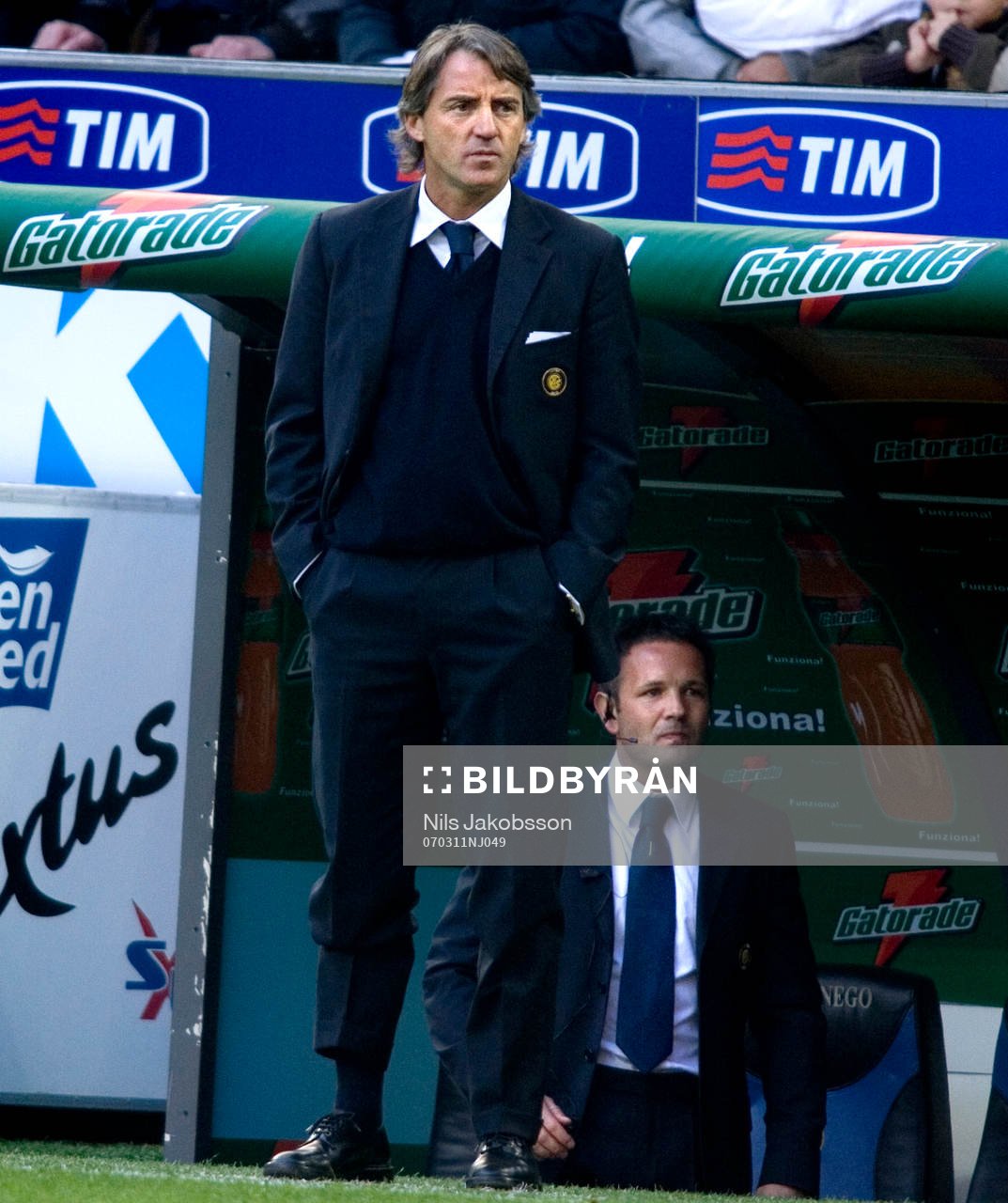 Roberto Mancini, tränare Inter, i bakgrunden Sinisa