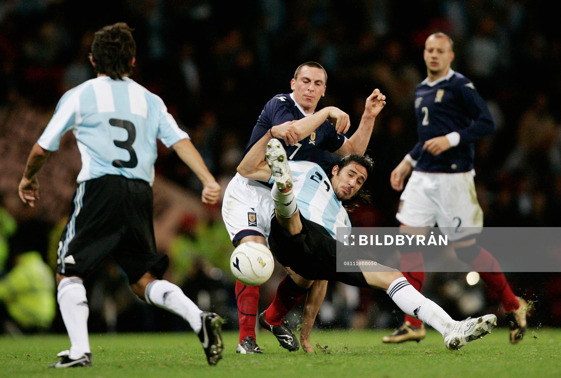 Scott Brown, Skottland och  Jonas Gutierrez, Argentina