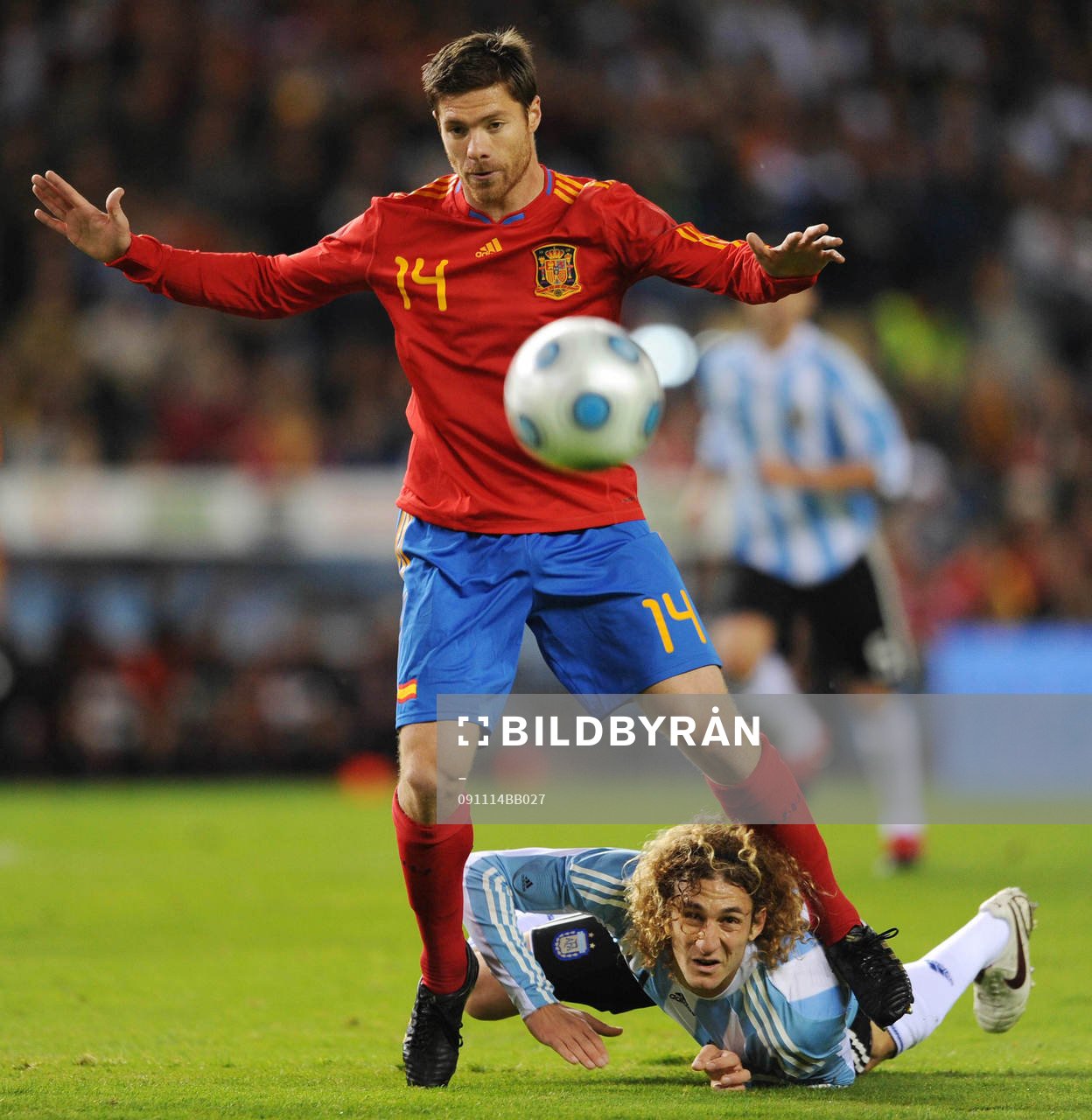 Xabi Alonso, Spanien och Fabricio Coloccini, Argentina