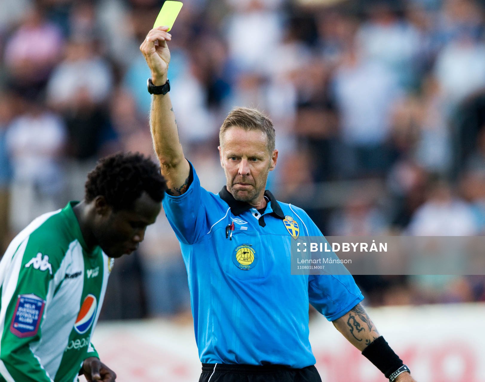Varning, Lars Olsson, domare, ger gult kort (varning) till