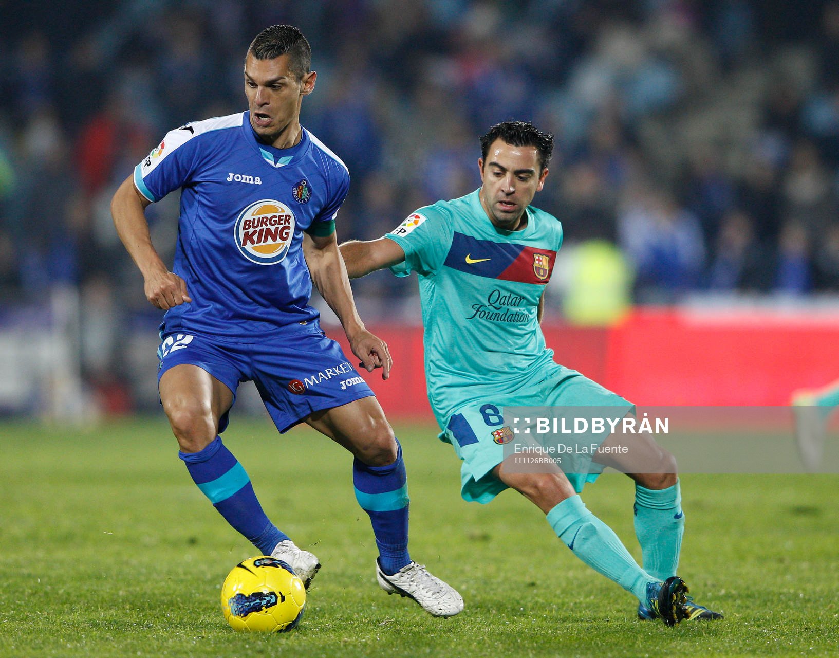  Casquero, Getafe och Xavi Hernandez, Barcelona.