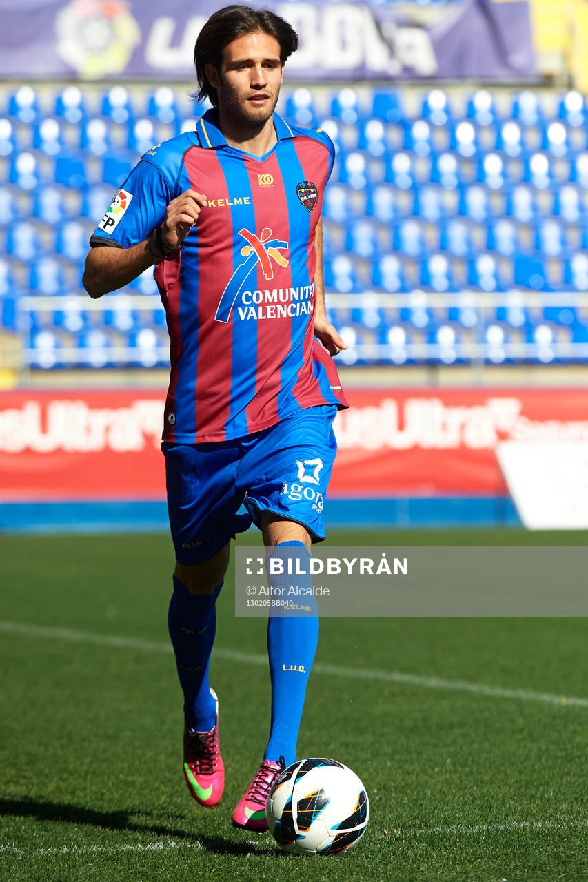 Robert Aquafresca poses with the ball at the new signing of