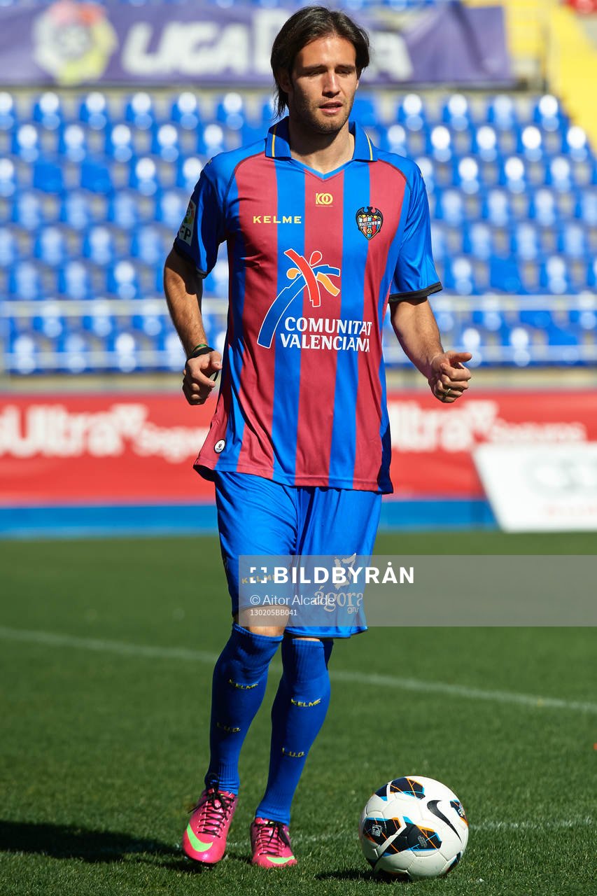 Robert Aquafresca poses with the ball at the new signing of