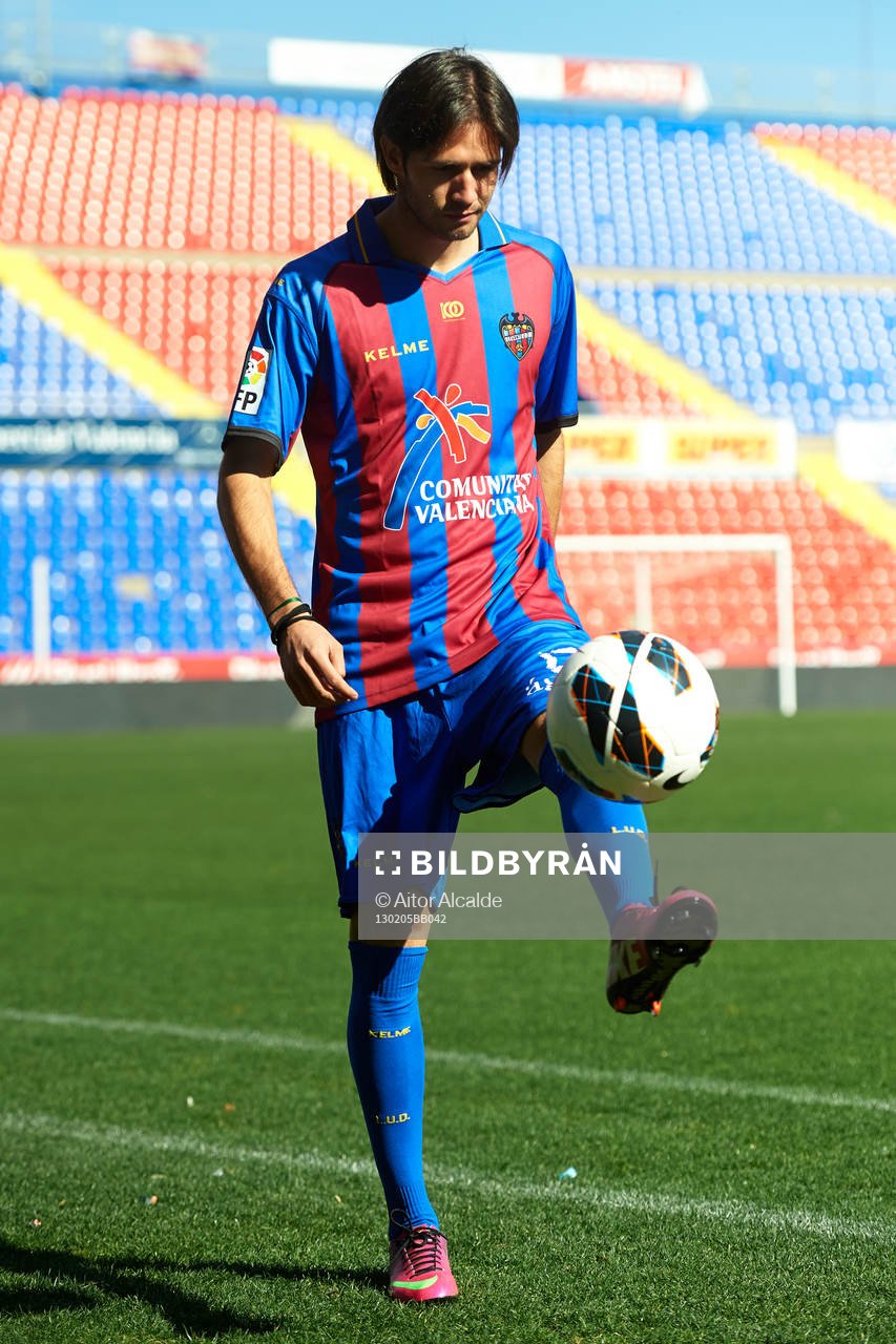 Robert Aquafresca poses with the ball at the new signing of