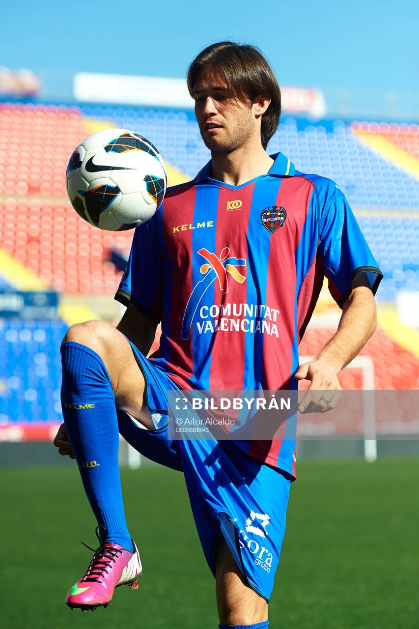 Robert Aquafresca poses with the ball at the new signing of