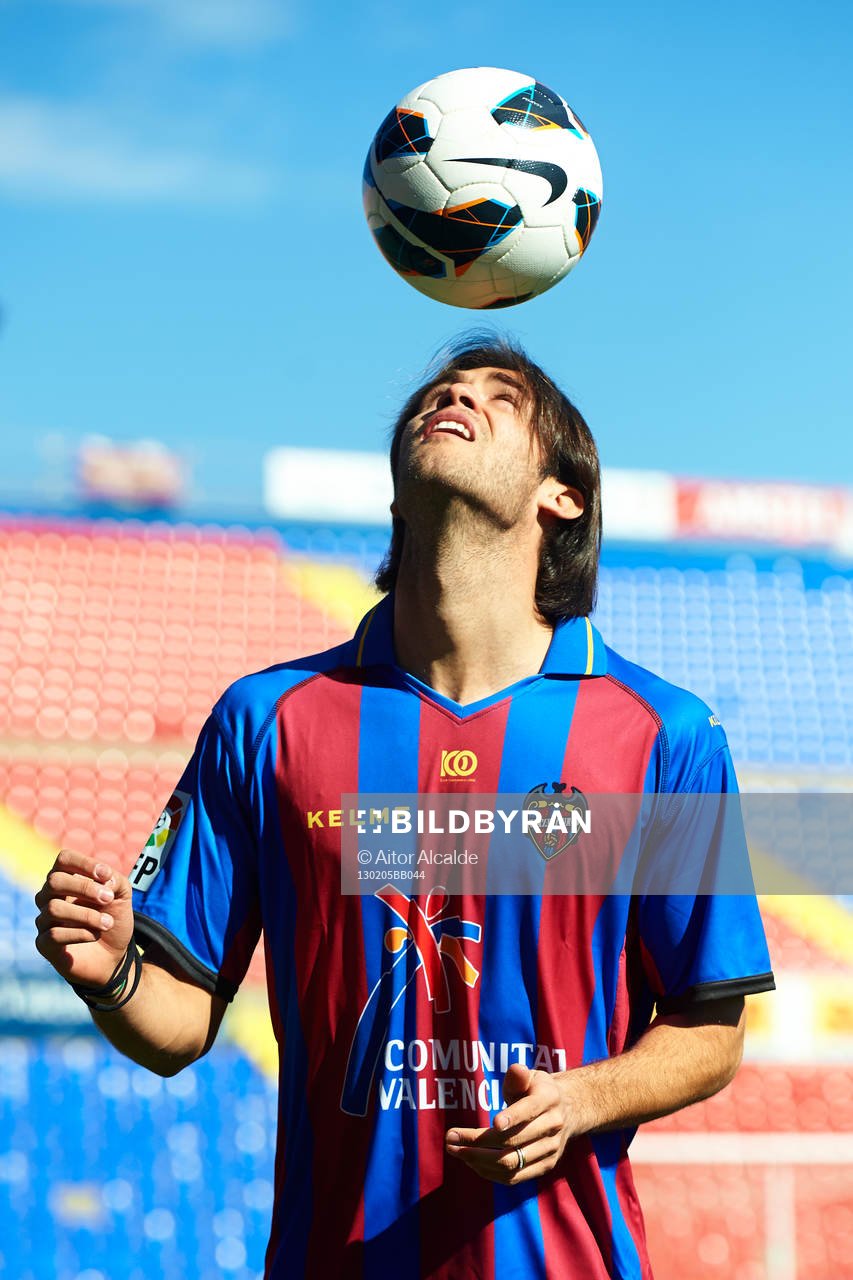 Robert Aquafresca poses with the ball at the new signing of