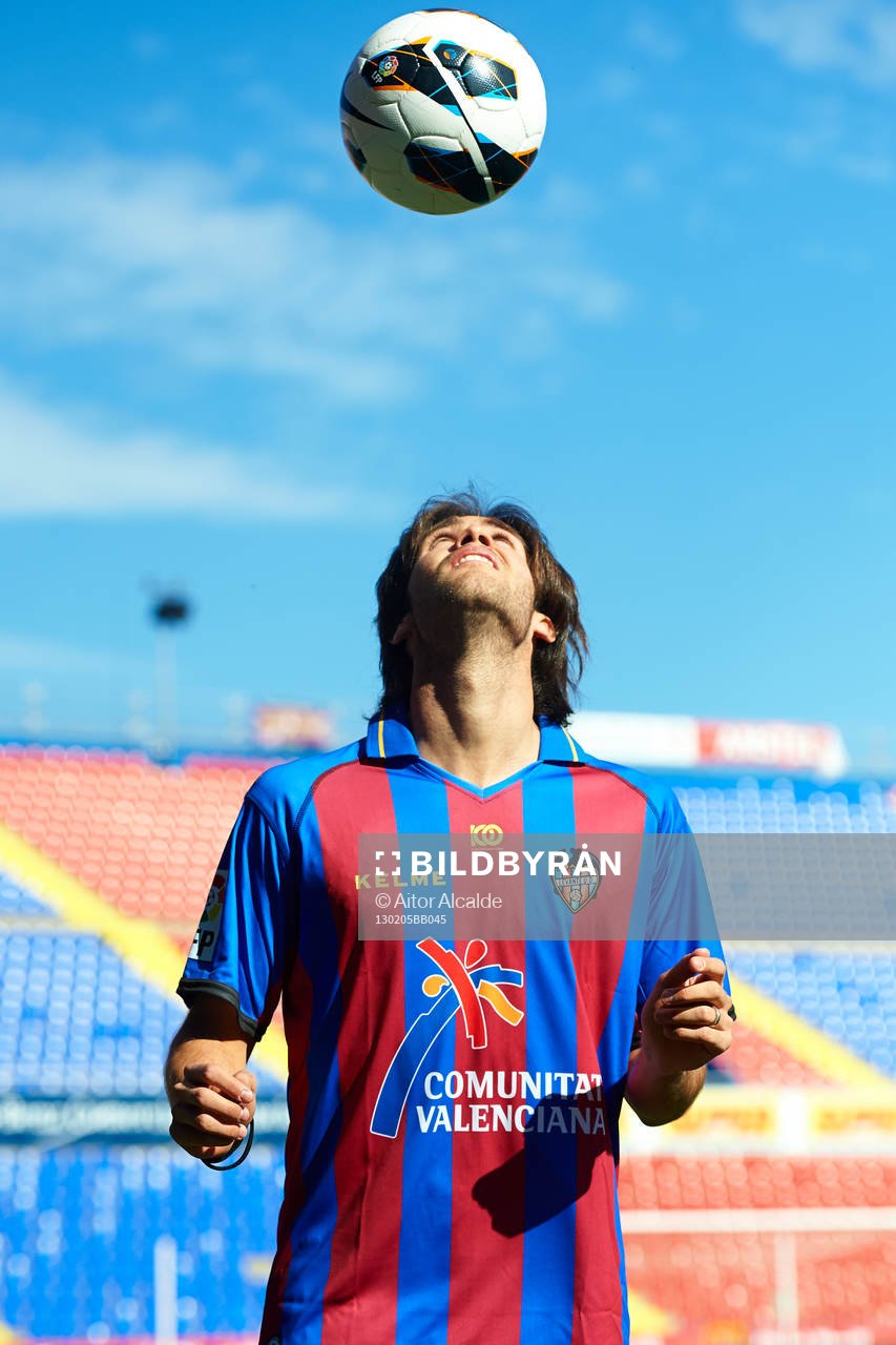 Robert Aquafresca poses with the ball at the new signing of