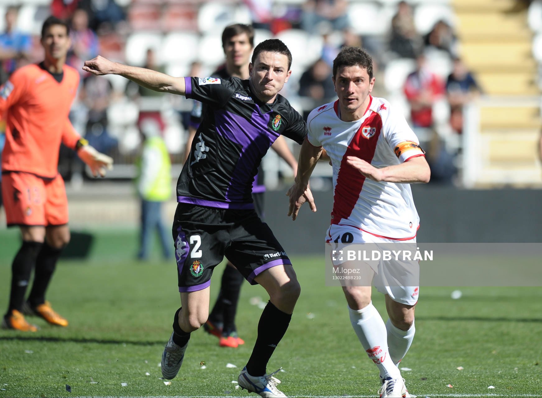player Rayo Vallecano Foward Piti (10) with Player Real
