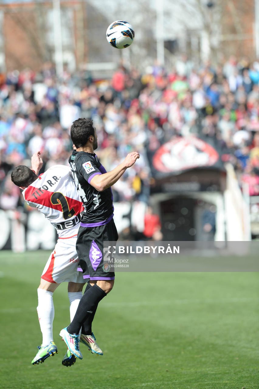 player Rayo Vallecano defense tito (2) with Player Real