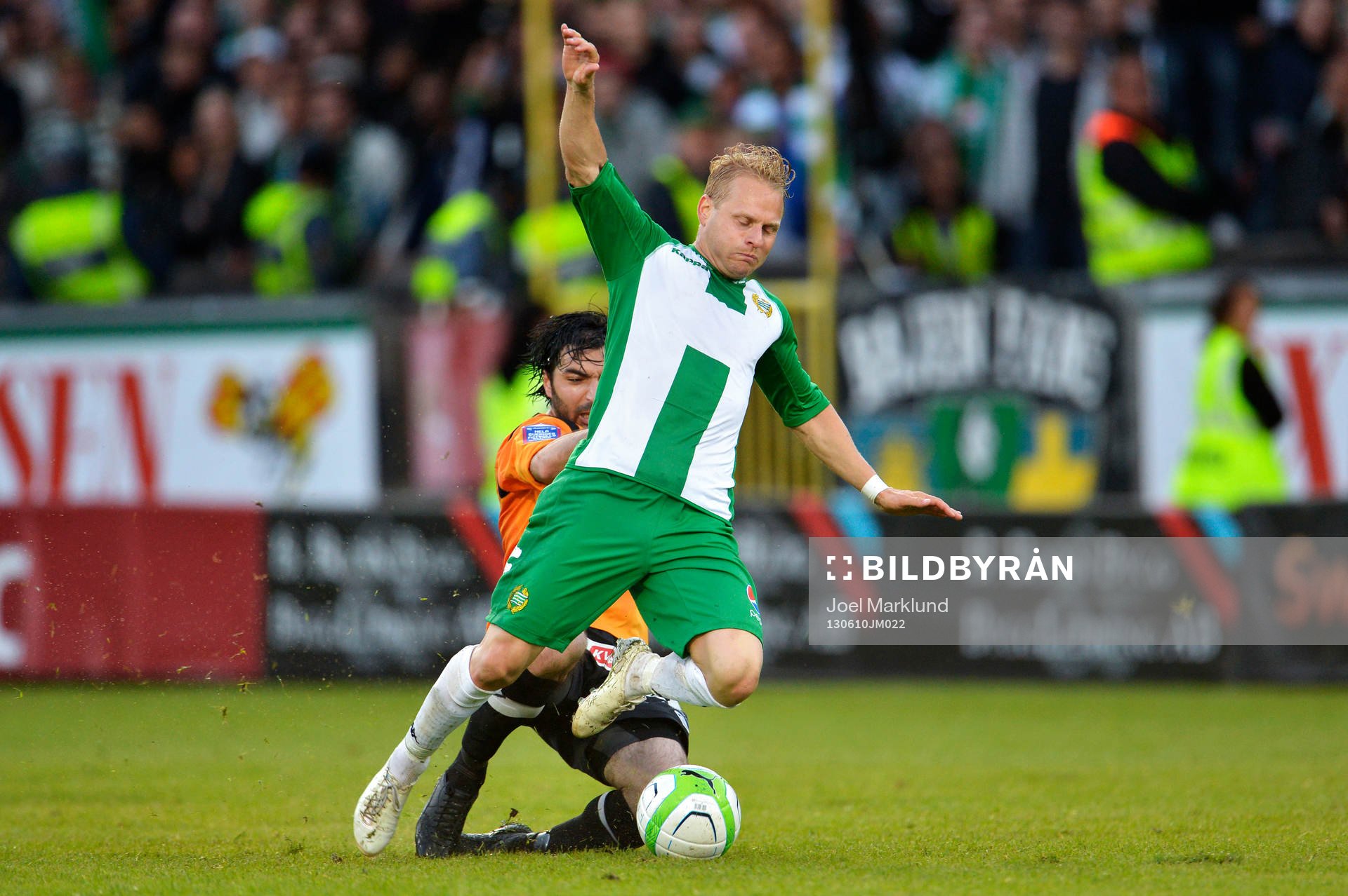 Varbergs Ahmet Özdemirok fäller Erik Sundin och blir utvisad i matchen mellan Hammarby och Varberg i Superettan i fotboll 10 juni 2013 i Stockholm.