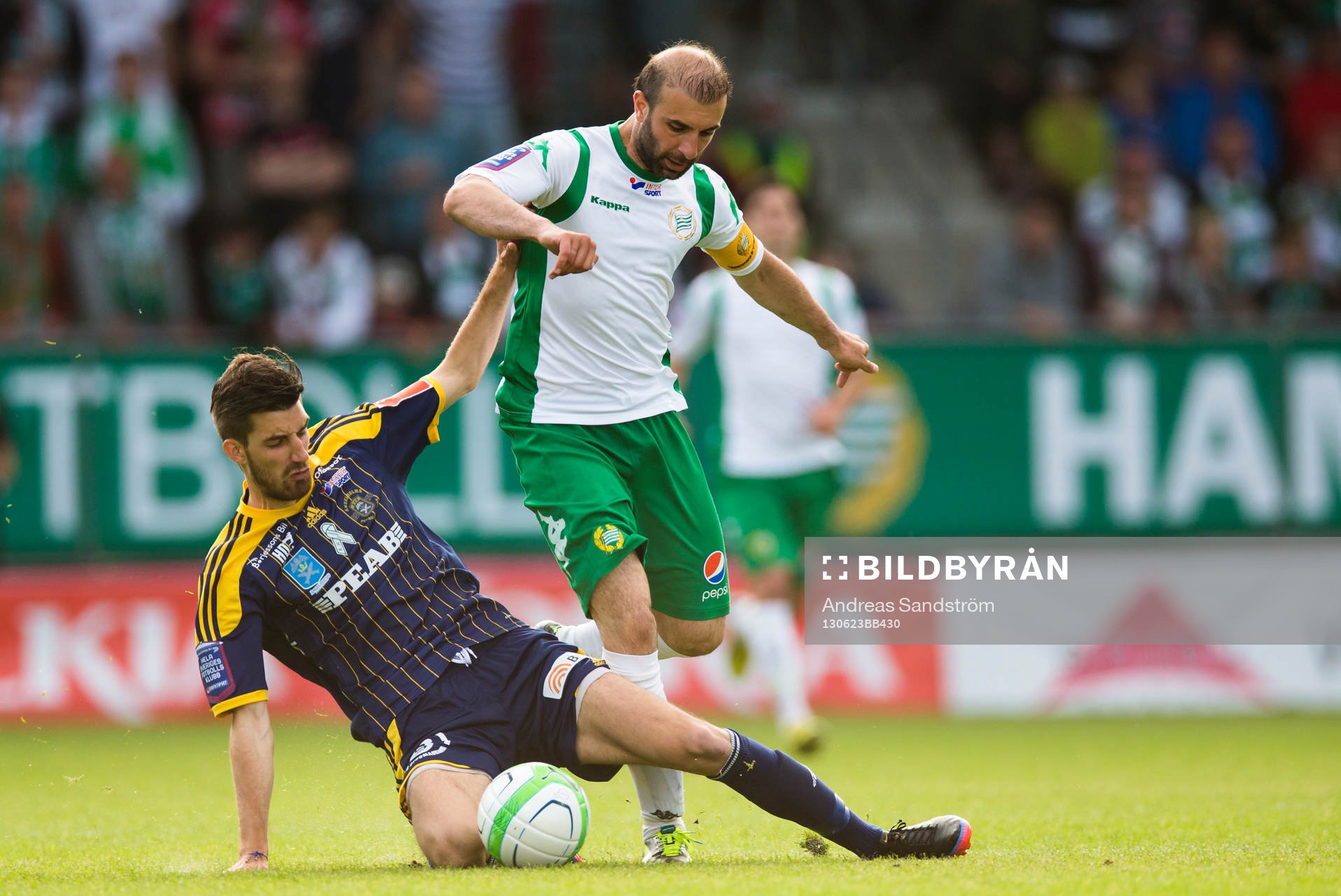 Hammarbys Kennedy Bakircioglü i kamp om bollen med Ängelholms Muamet Asanovski i matchen mellan Hammarby och Ängelholm i Superettan i fotboll 23 Juni 2013 i Stockholm. 