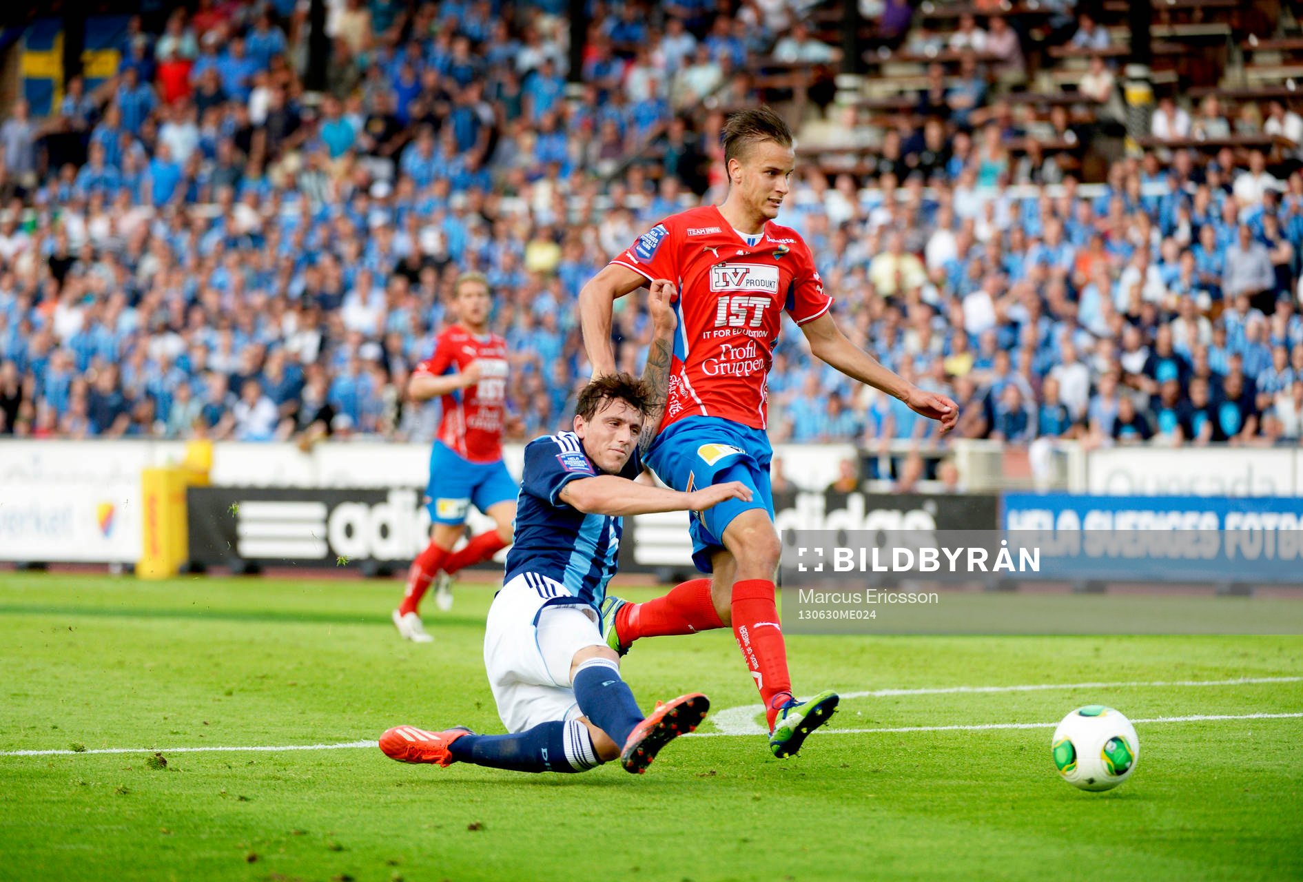 Erton Fejzullahu faller mot Mario Vasilj i målområdet  i matchen mellan Djurgården och Öster den 30 juni 2013 i Stockholm.