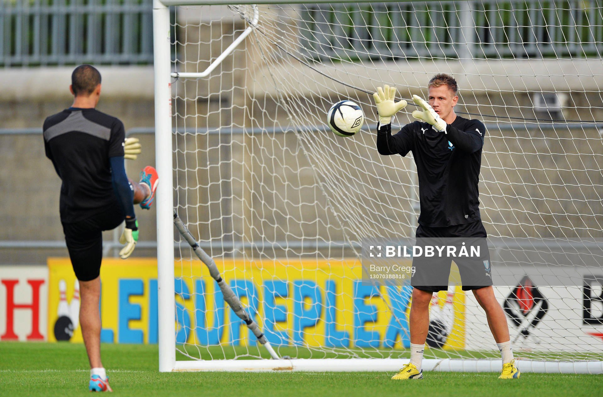Malmö goalkeepers Johan Dahlin, right, practices with