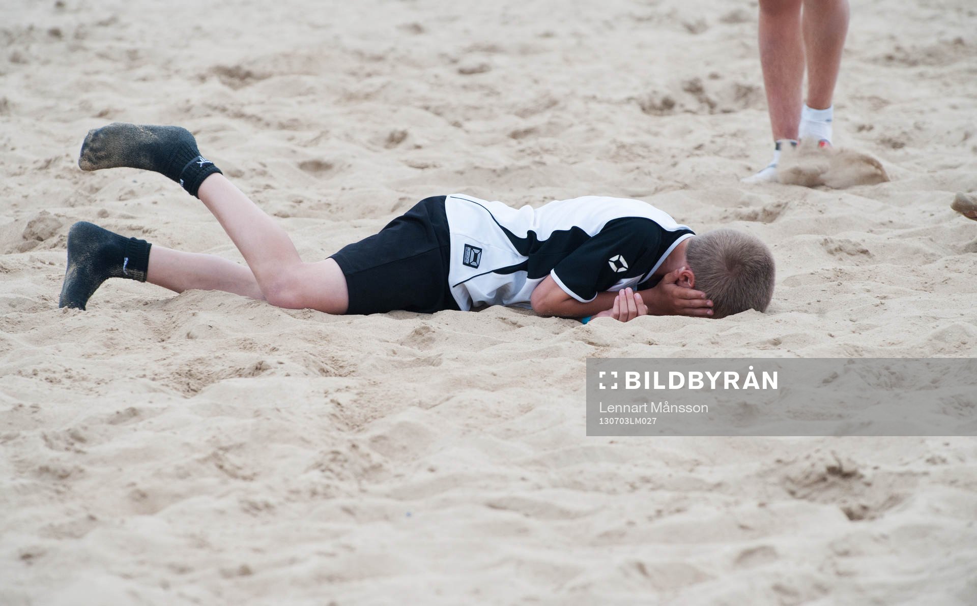 Sand, beachsoccerplan, skada, skadad spelare