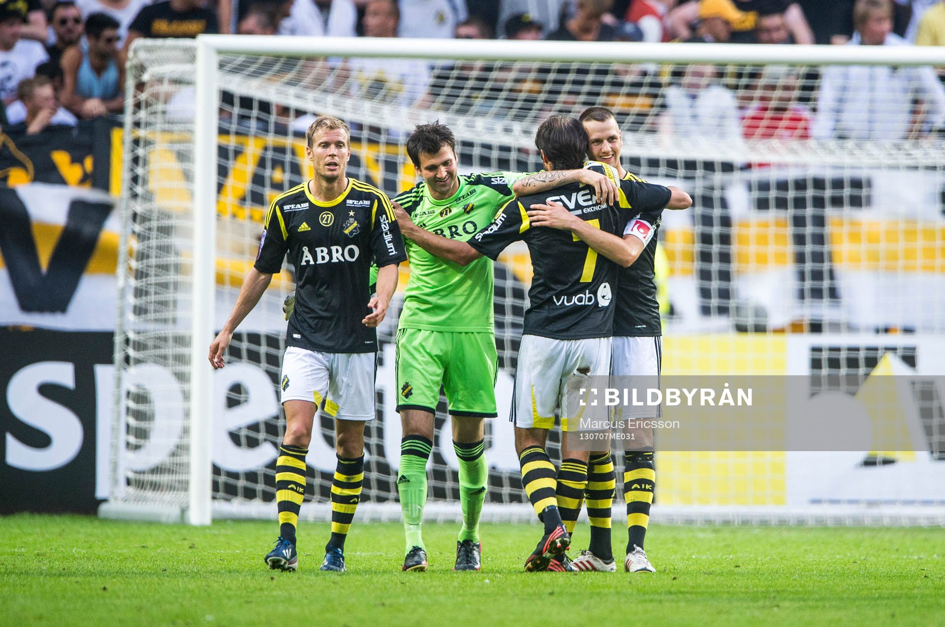 AIK:s Per Karlsson, målvakt Kyriakos Stamatopoulos, Helgi Danielsson och Alexander Milosevic kramas om efter den allsvenska matchen mellan AIK och Häcken den 7 juli 2013 i Stockholm.