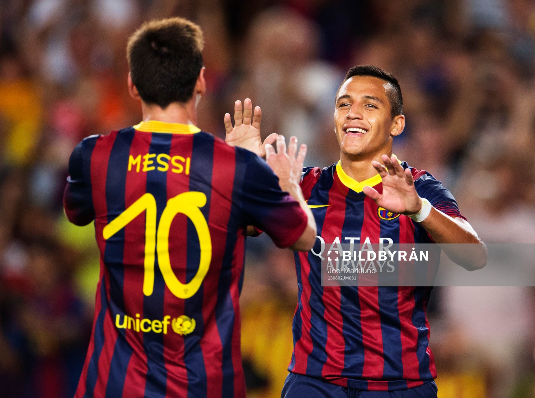 Barcelonas Lionel Messi och Alexis jublar