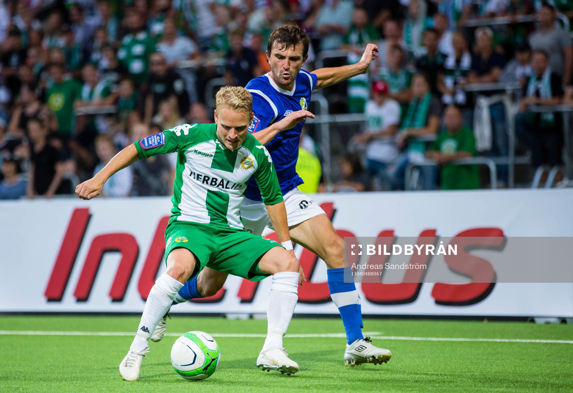 Hammarbys Erik Sundin i kamp om bollen med Ljungskiles Aleksandar Kitic under fotbollsmatchen i Superettan mellan Hammarby och Ljungskile den 4 Augusti 2013 i Stockholm.