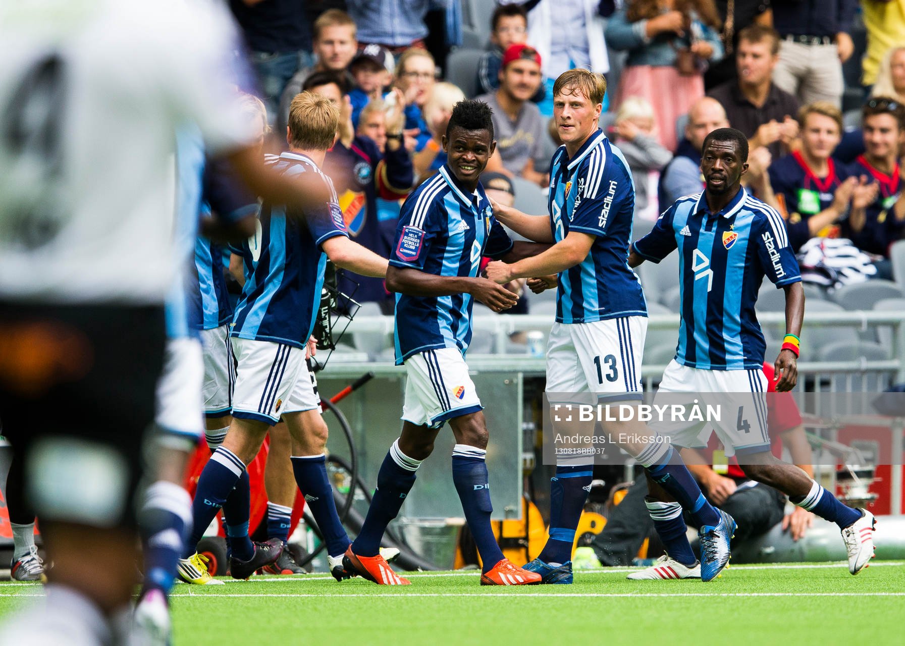 Djurgårdens Godsway Donyoh jublar tillsammans med Djurgårdens Emil Bergström och Yussif Chibsah efter att ha gjort 1-0 för Djurgården under fotbollsmatchen i Allsvenskan mellan Djurgården och Häcken den 18 augusti 2013 i Stockholm.