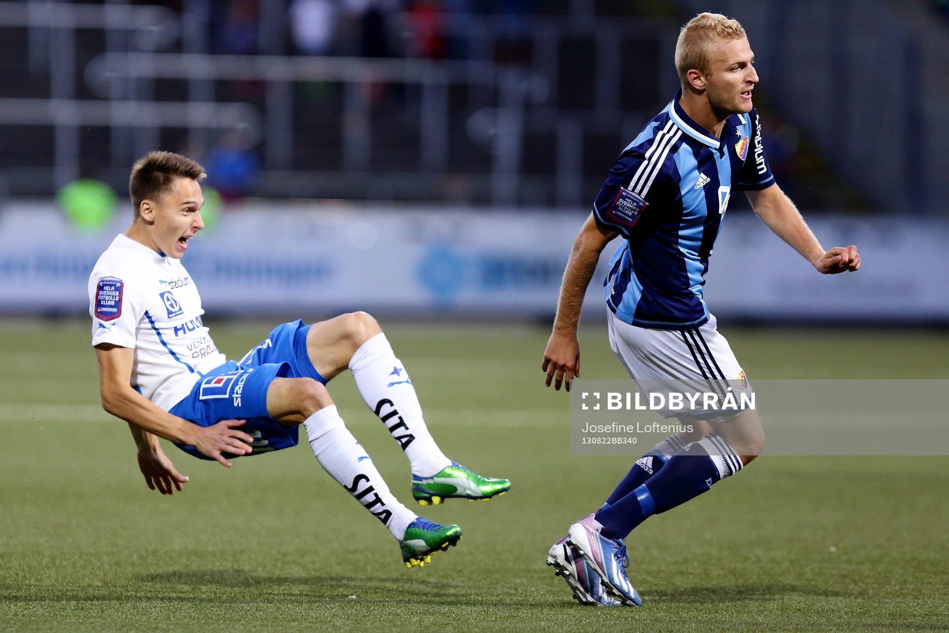 Norrköpings Siim Luts faller bakom Djurgårdens Vytautas Andriuskevicius i fotbollsmatchen mellan Norrköping och Djurgården i Allsvenskan i fotboll den 22 augusti 2013 i Norrköping.