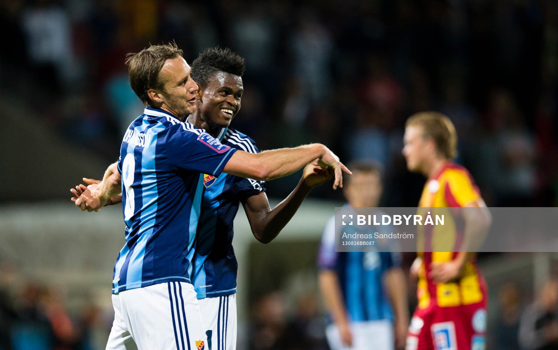 Djurgårdens Andreas Johansson gör 3-1 på straff och gratuleras av Godsway Donyoh (h) under fotbollsmatchen i Allsvenskan mellan Syrianska och Djurgården den 26 Augusti 2013 i Södertälje.