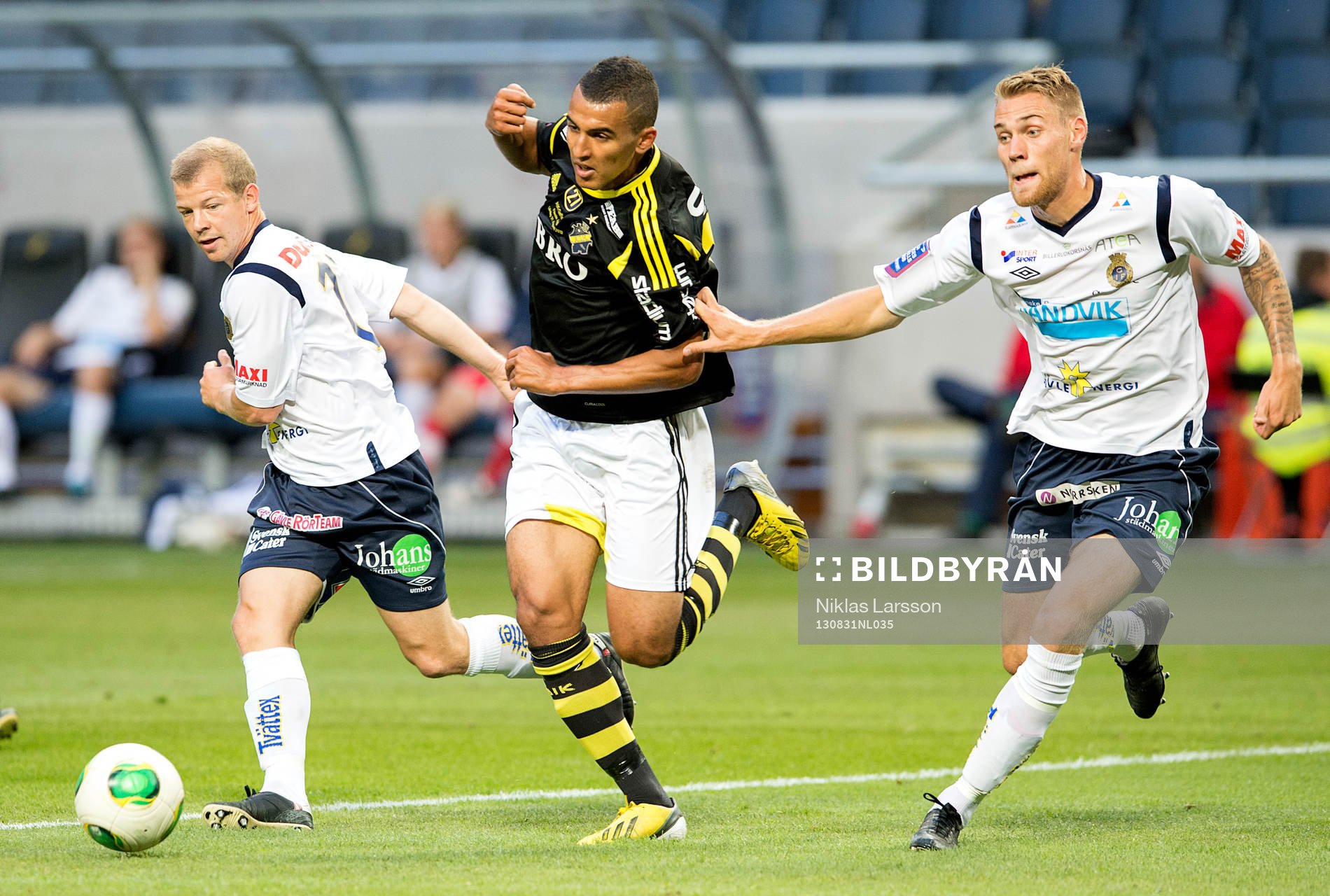 Anders Wikström, Gefle och Jonas Lantto, Gefle blir bortdribblade av Nabil Bahoui, AIK under en fotbollsmatch i Allsvenskan mellan AIK och Gefle, den 31 augusti 2013 i Stockholm.