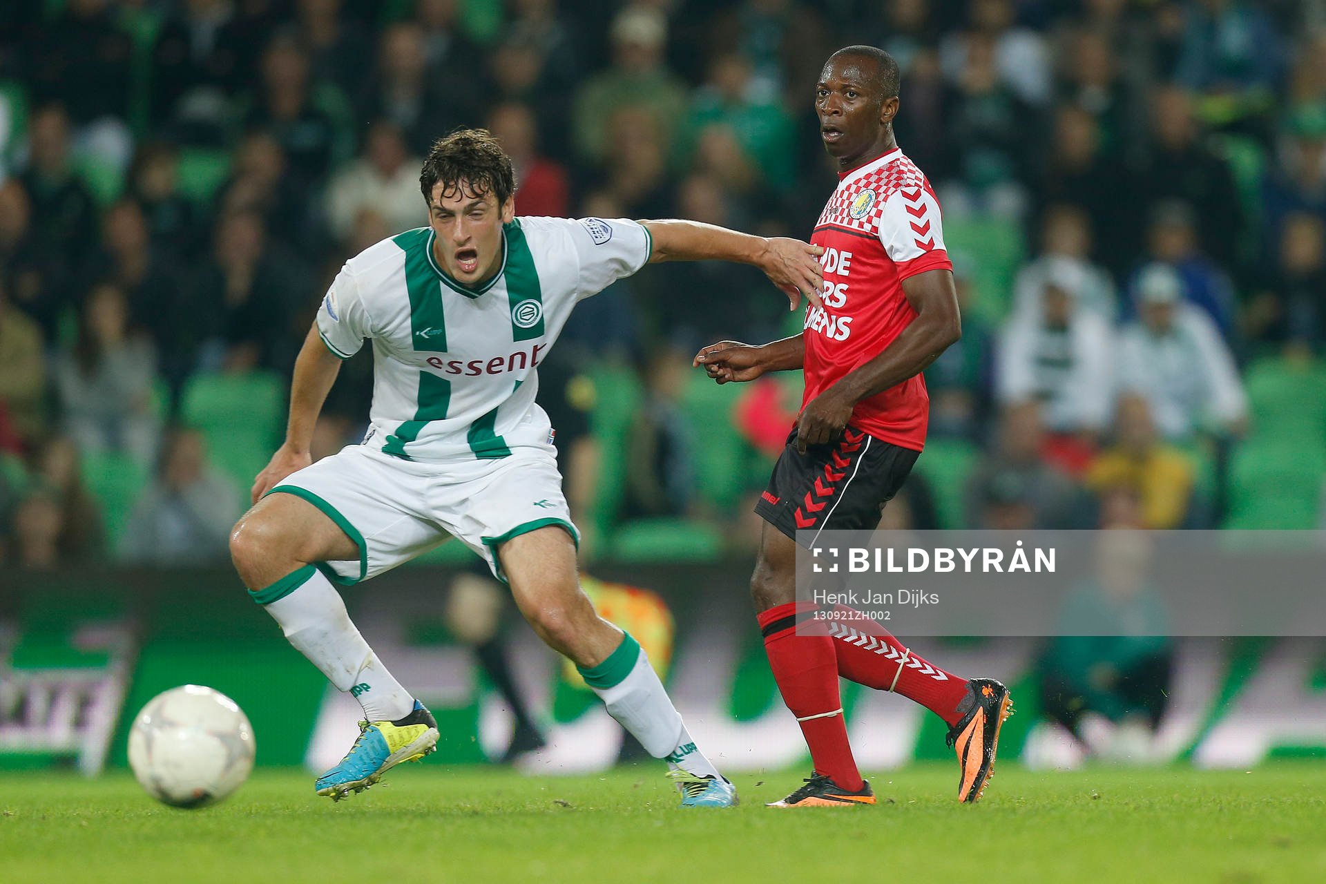  GRONINGEN - FC Groningen - RKC Waalwijk ,  Eredivisie, voetbal, seizoen 2013-2014, De Euroborg ,  21-09-2013,   FC Groningen speler Eric Botteghin (l) met RKC Waalwijk speler Romeo Castelen (r).