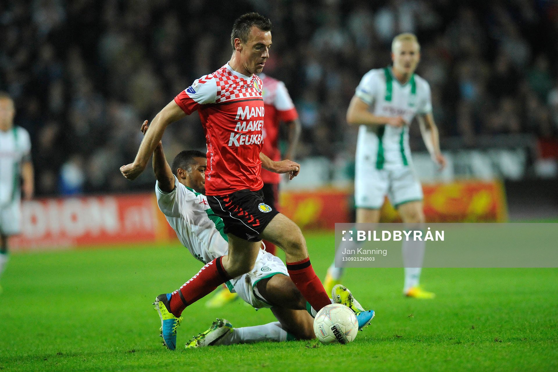  GRONINGEN - Voetbal, FC Groningen - RKC,  Eredivisie, stadion Euroborg, seizoen 2013-2014, 21-09-2013, RKC Waalwijk speler Peter Junschlager met FC Groningen speler Johan Kappelhof