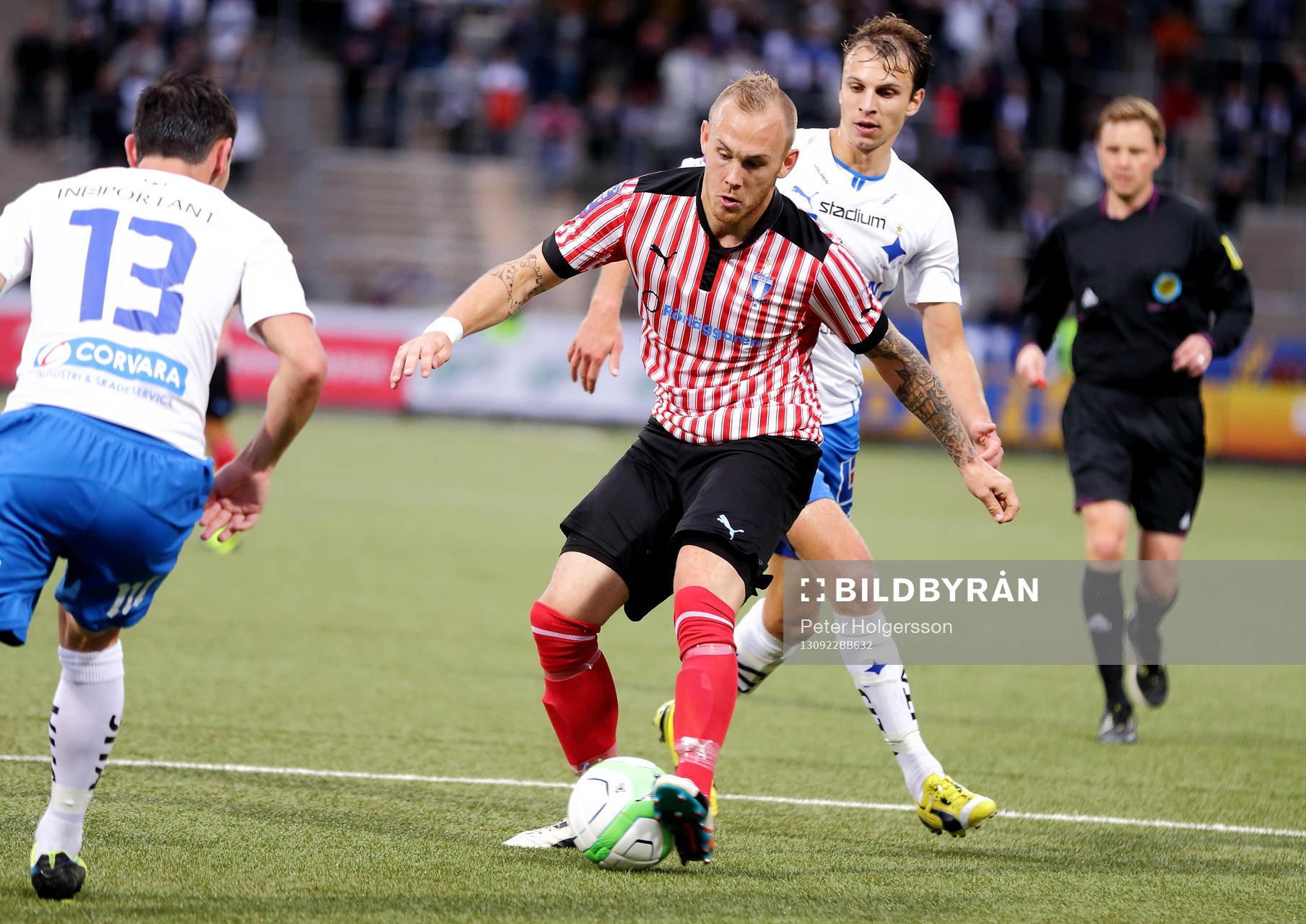 Malmös Magnus Eriksson och Norrköpings Lars Christian Krogh Gerson i fotbollsmatchen mellan Norrköping och Malmö i Allsvenskan den 22 september 2013 i Norrköping.