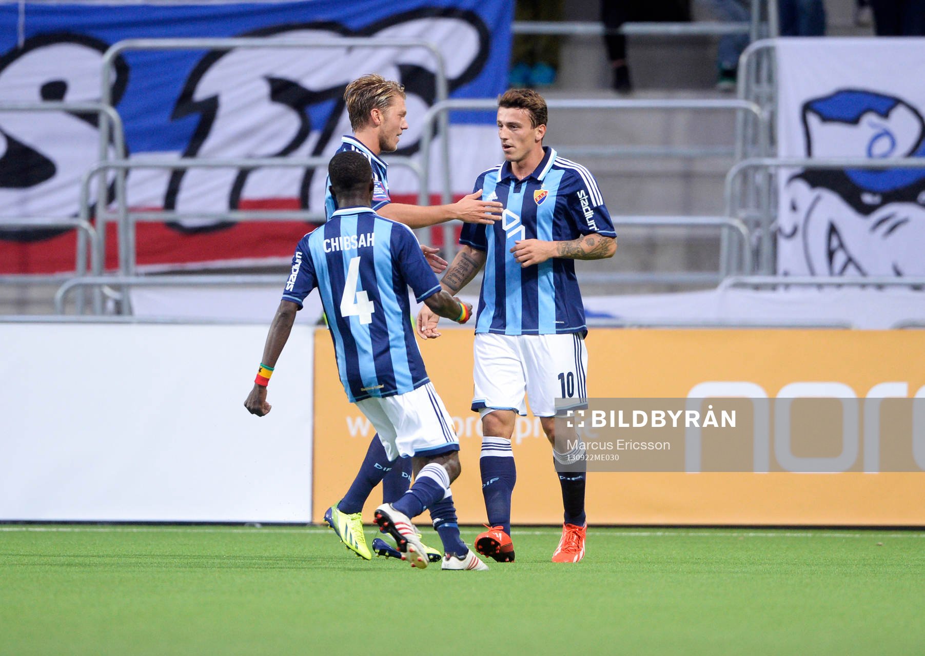 Målskytten Djurgårdens Erton Fejzullahu kramas om av Yussif Chibsah och Martin Broberg under fotbollsmatchen mellan Djurgården och Åtvidaberg i Allsvenskan den 22 september 2013 i Stockholm.