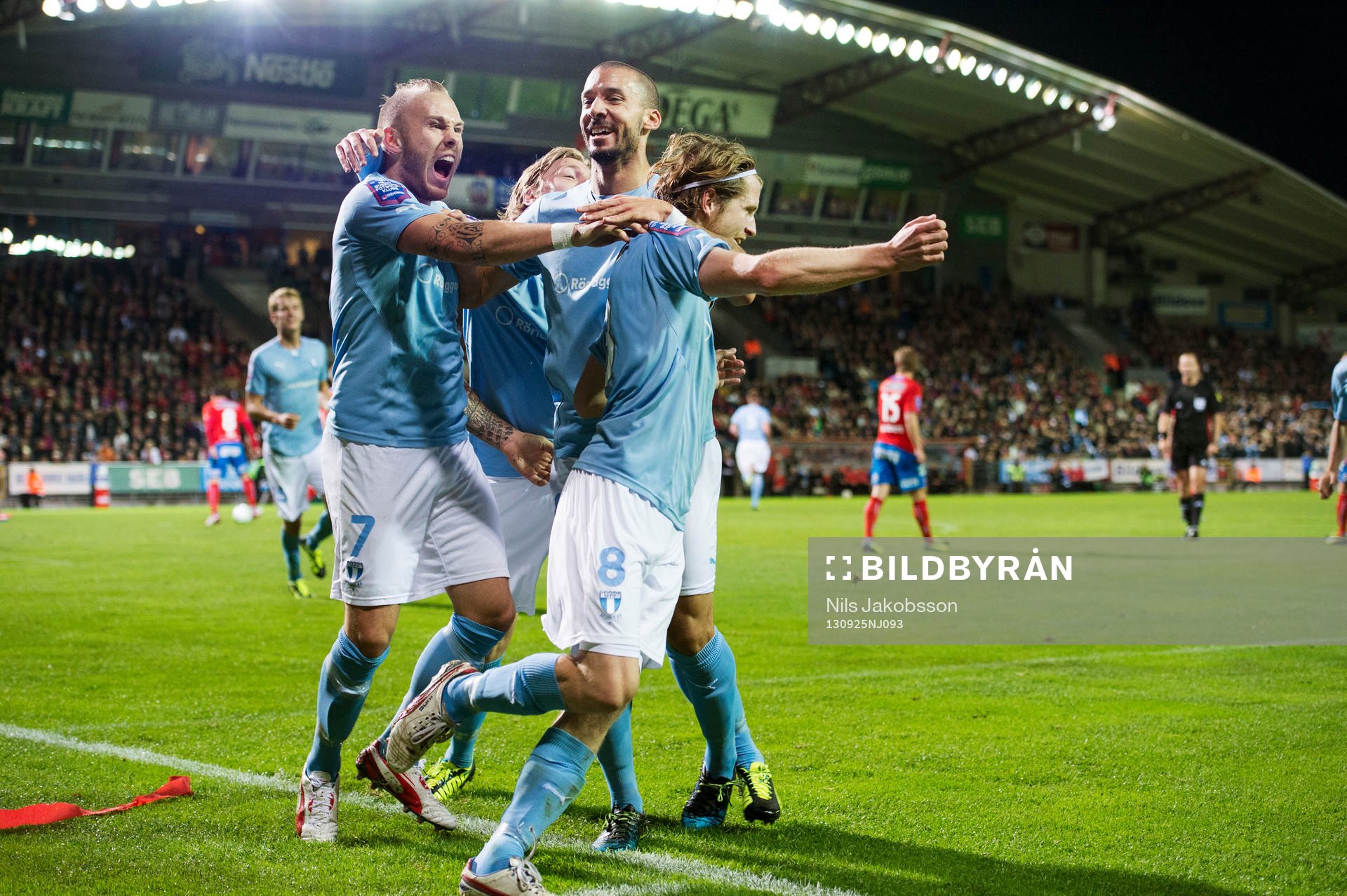 Malmös Magnus Eriksson, Guillermo Molins, Erik Friberg jublar under den allsvenska fotbollsmatchen mellan Helsingborg och Malmö FF den 25 september 2013 i Helsingborg.