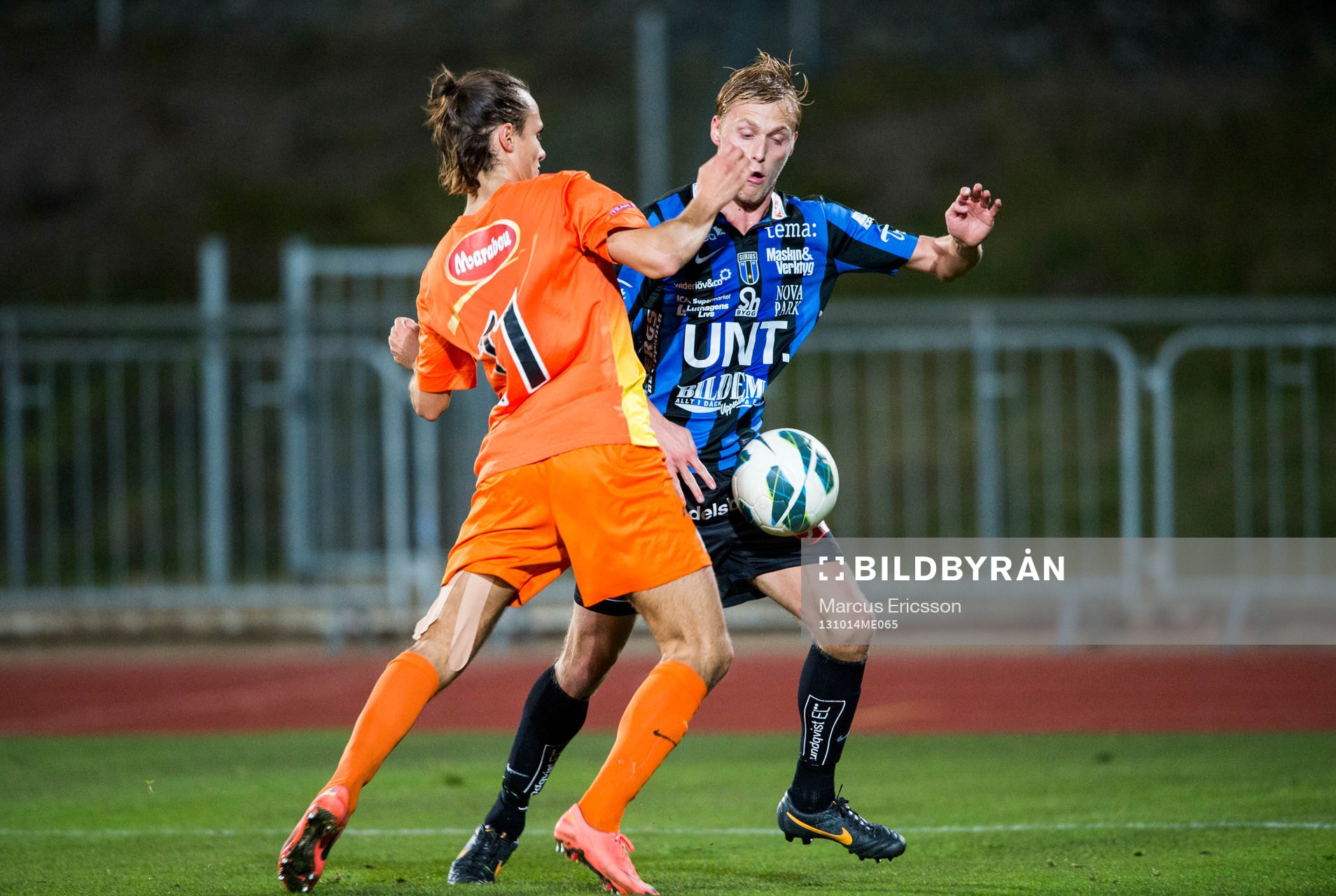 Athletics Linus Smedjegården och Sirius Christer Gustafsson under fotbollsmatchen mellan Athletic FC United och IK Sirius i div 1 norra den 14 oktober 2013 i Stockholm.
