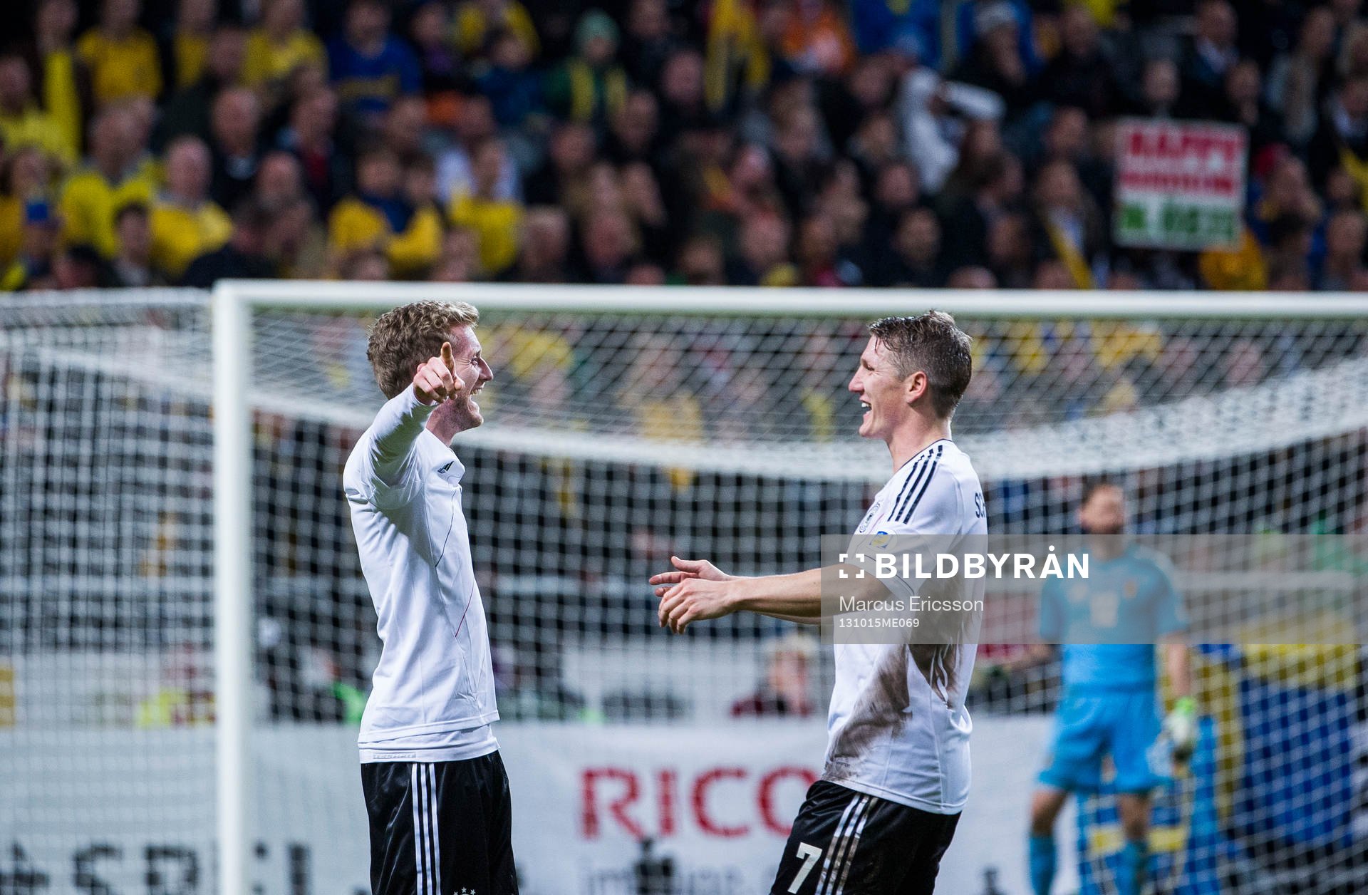 Tysklands André Schürrle och Bastian Schweinsteiger