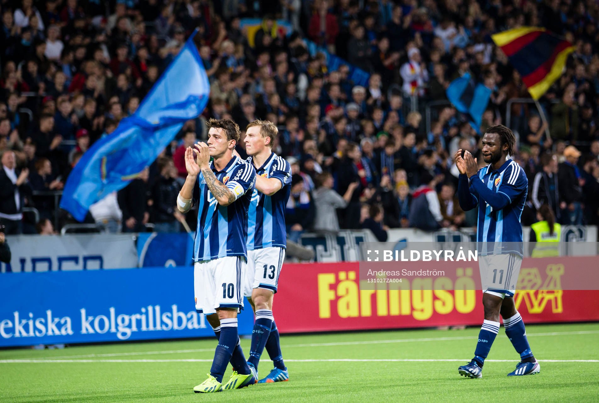 Djurgårdens Erton Fejzullahu, Emil Bergström och Amadou Jawo tackar publiken efter fotbollsmatchen i Allsvenskan mellan Djurgården och Gefle den 27 Oktober 2013 i Stockholm.
