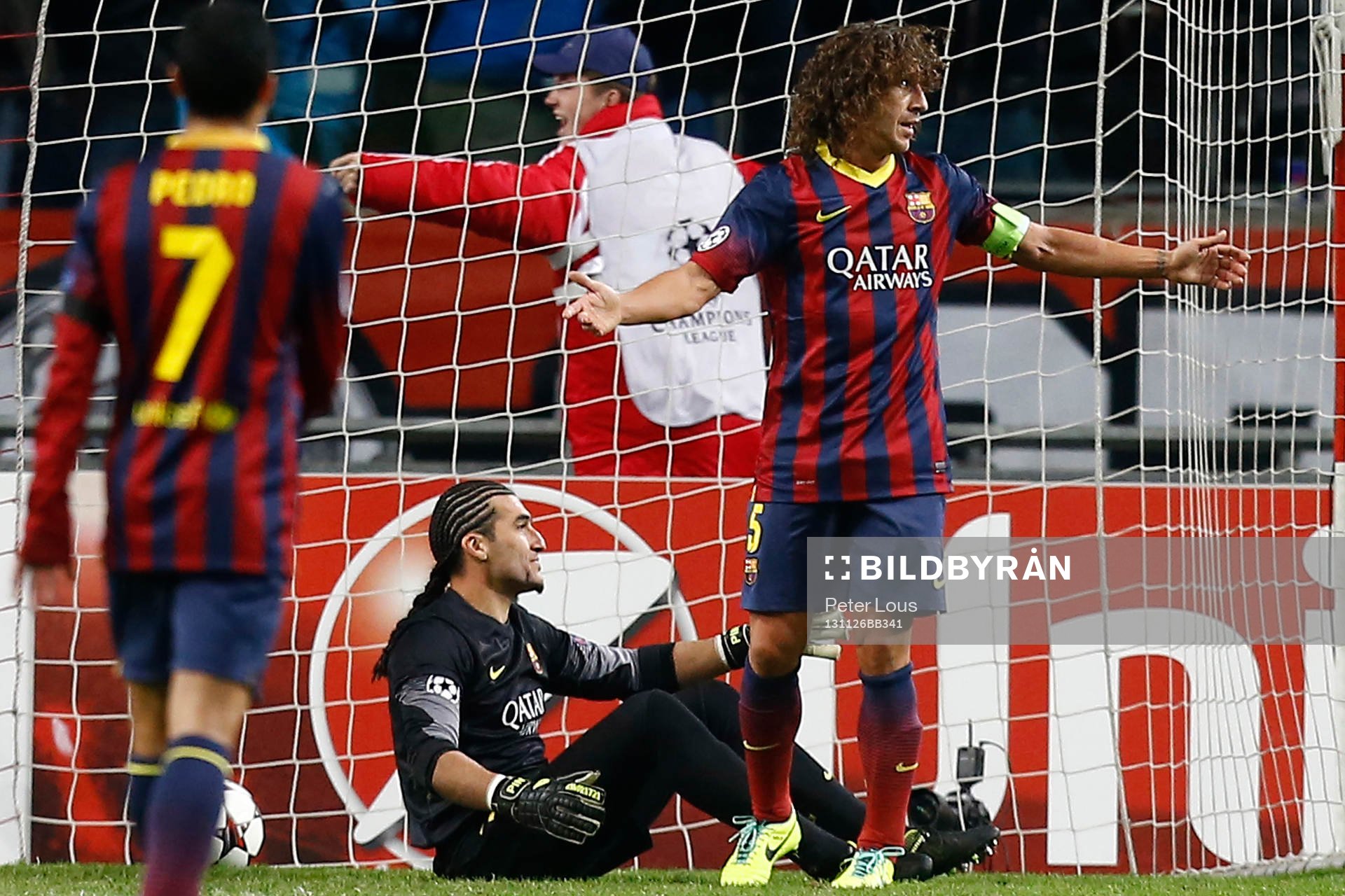 AMSTERDAM - Ajax - Barcelona , Voetbal Champions League , seizoen 2013-2014 , 26-11-2013 , Amsterdam Arena , Barcelona speler Carlos Puyol (r) baalt als het 1-0 is geworden voor Ajax.