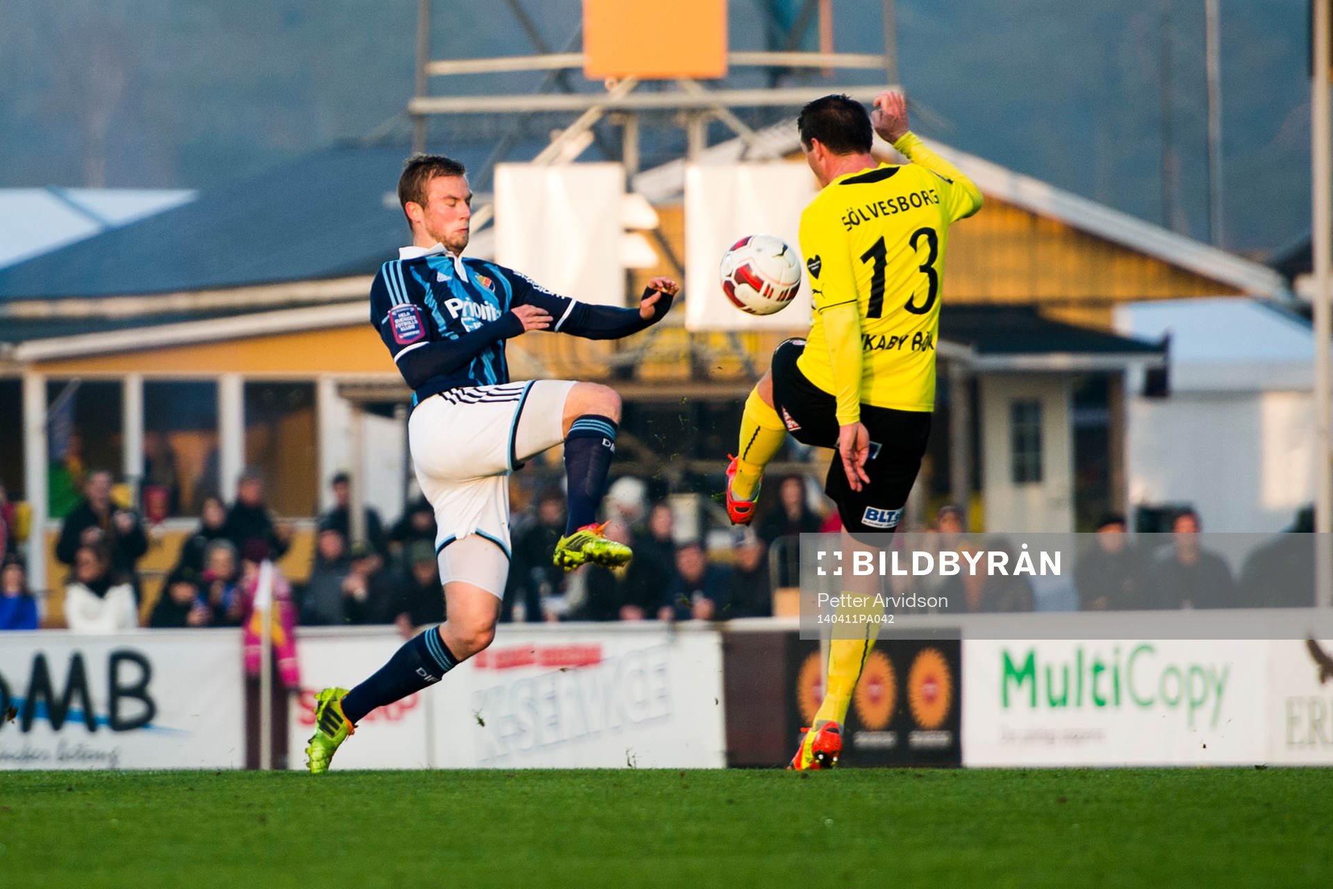 Djurgårdens Aleksander Faltsetas och Mjällbys Daniel Nilsson under fotbollsmatchen i Allsvenskan mellan Mjällby och Djurgården den 11 april 2014 i Mjällby.