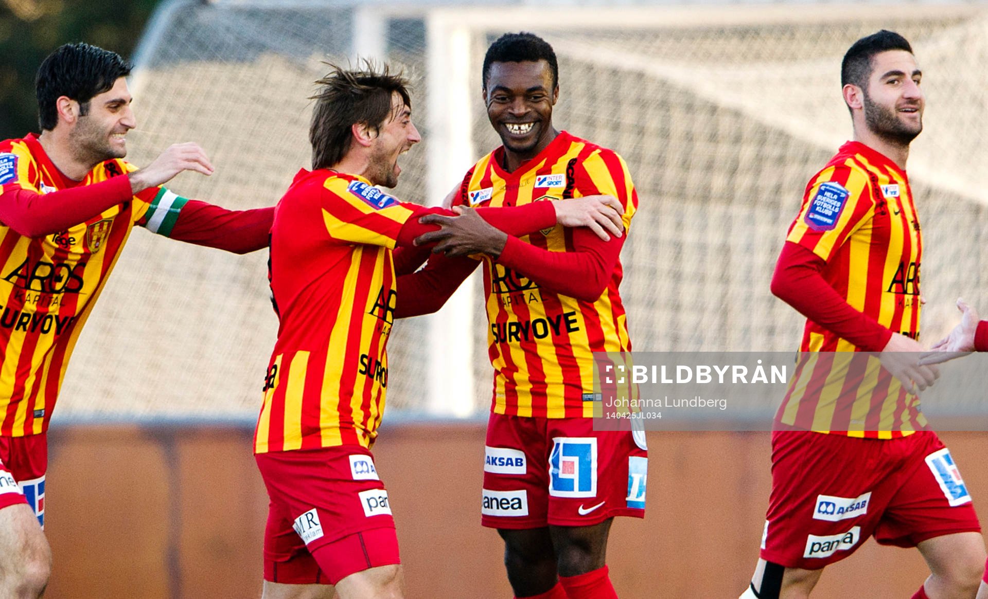 Syrianskas Nikola Grubješic (mitten) har gjort mål och jublar med Success Chimankpa Nwosu (th)under fotbollsmatchen i Superettan mellan Syrianska och Östersund den 25 april 2014 i Södertälje.