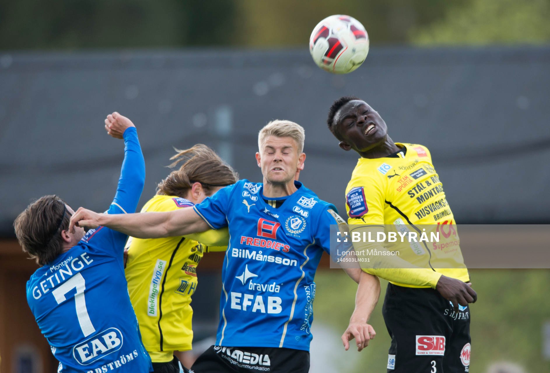 Mjällbys Gbenga Arokoya och Halmstads Viktor Ljung  i matchen i allsvenskan mellan Mjällby och Halmstad i Hällevik 3 maj  2014.