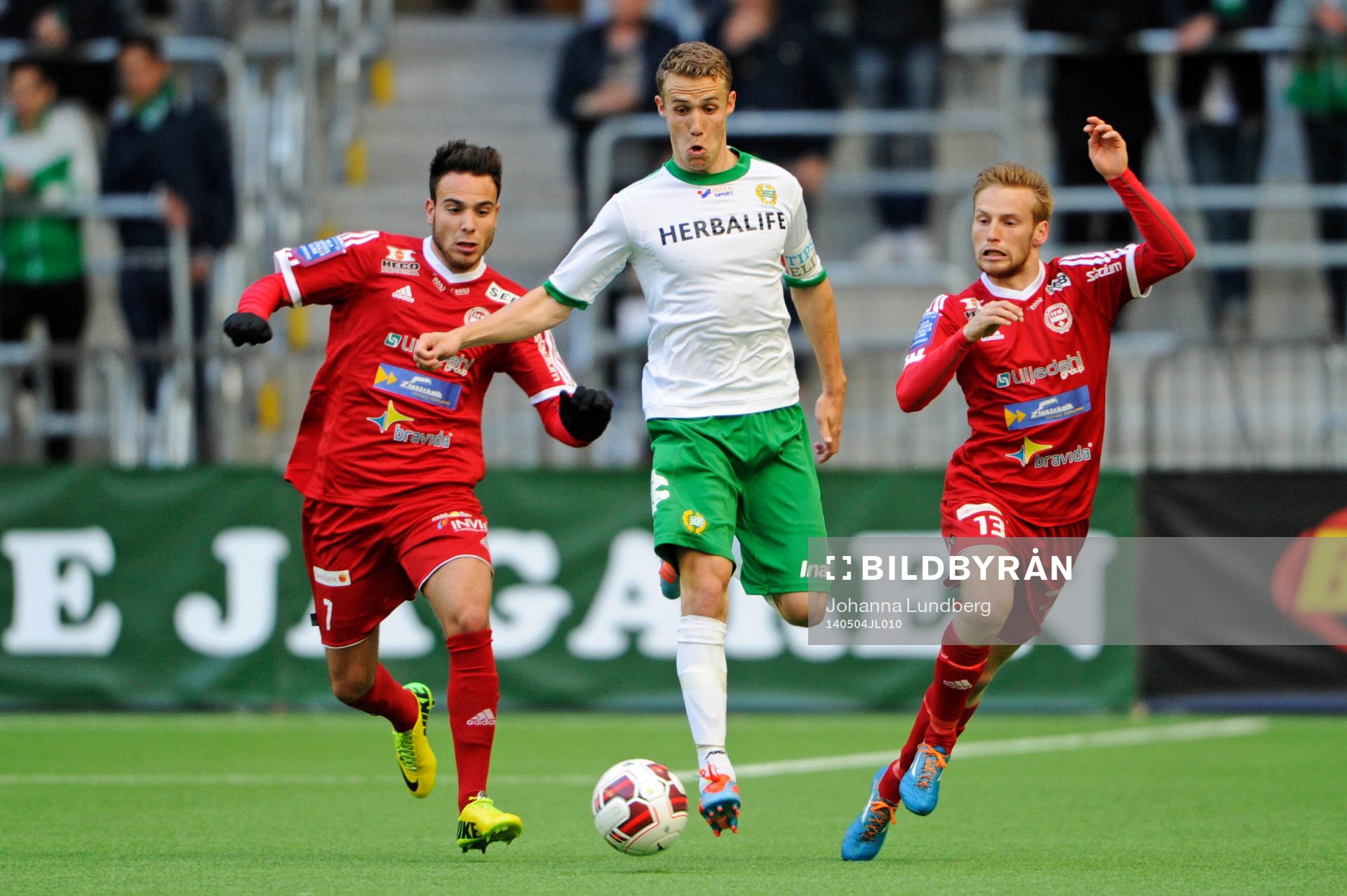 Värnamos Dzenis Kozica och Tobias Englund och Hammarbys Erik Israelsson under fotbollsmatchen i Superettan mellan Hammarby och Värnamo den 4 maj 2014 i Stockholm.