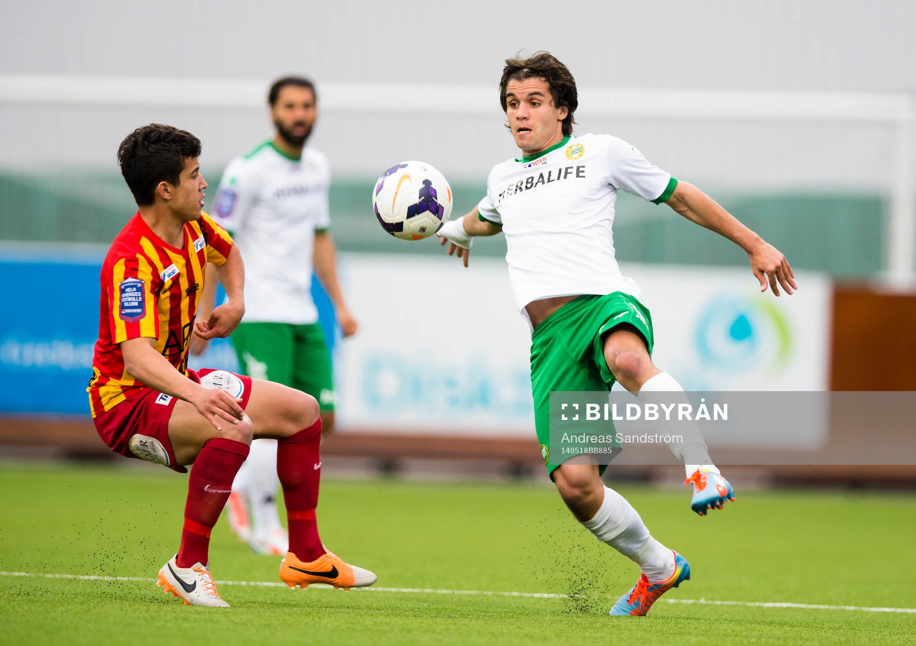 Hammarbys Lars Mendonca Fuhre i kamp om bollen med Syrianskas Igor Santos Koppe under fotbollsmatchen i Superettan mellan Syrianska och Hammarby den 18 Maj 2014 i Södertälje.