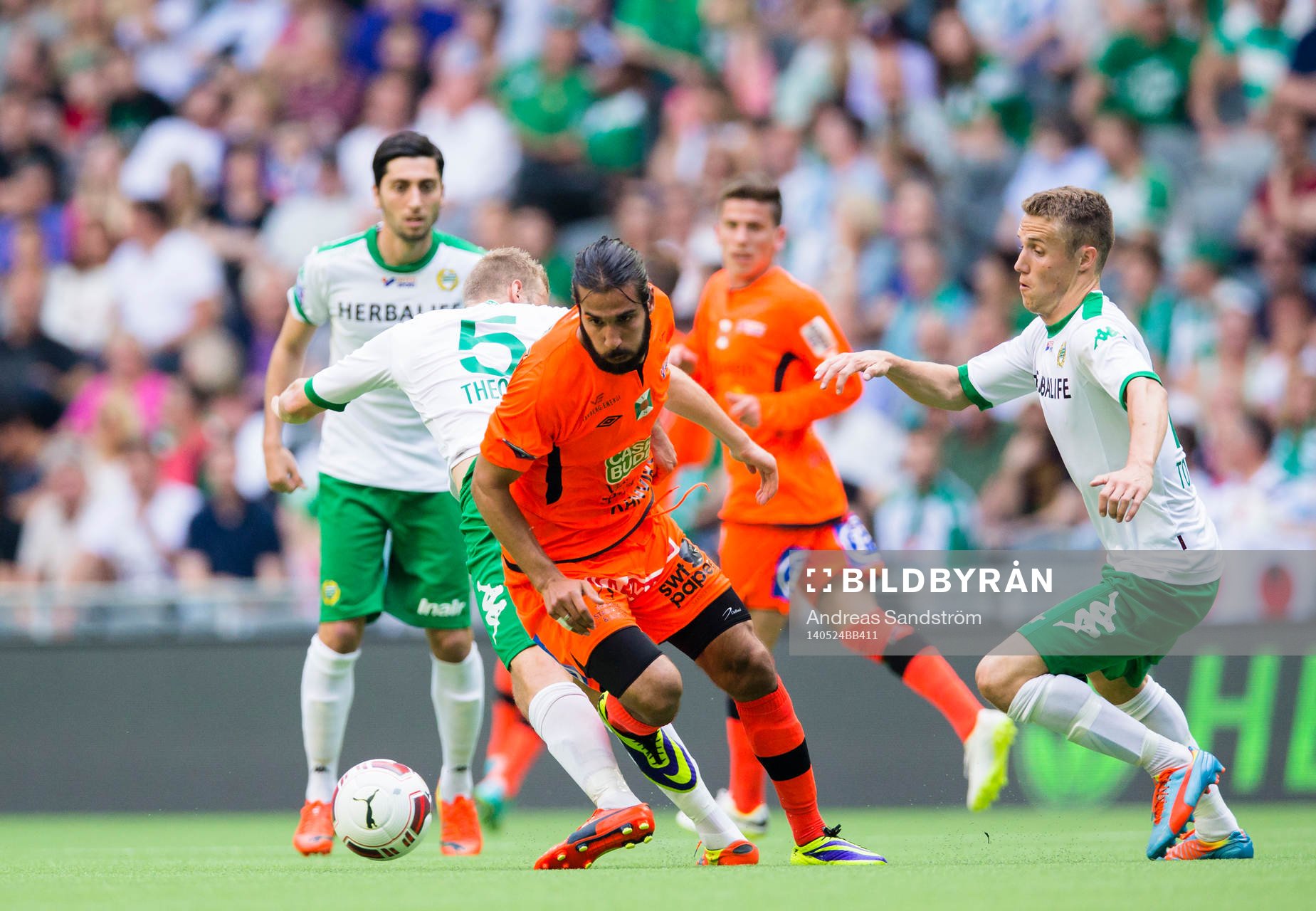 Varbergs Ali Sinan Ayranci i kamp med Hammarbys Daniel Theorin under fotbollsmatchen i Superettan mellan Hammarby och Varberg den 24 Maj 2014 i Stockholm.