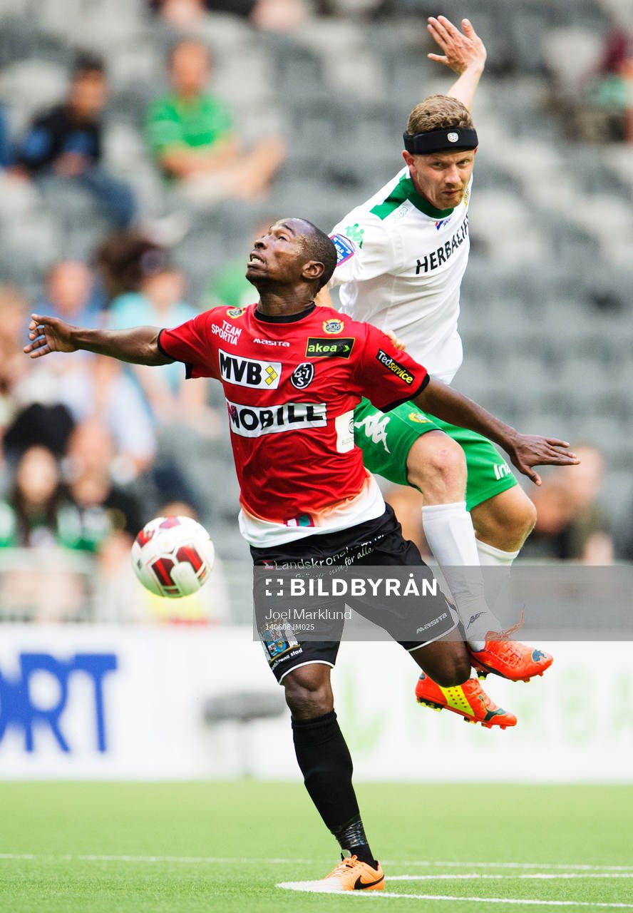 Landskronas Sadat Karim och Hammarbys Thomas Guldborg Christensen i en nickduell under fotbollsmatchen i Superettan mellan Hammarby och Landskrona den 8 juni 2014 i Stockholm.