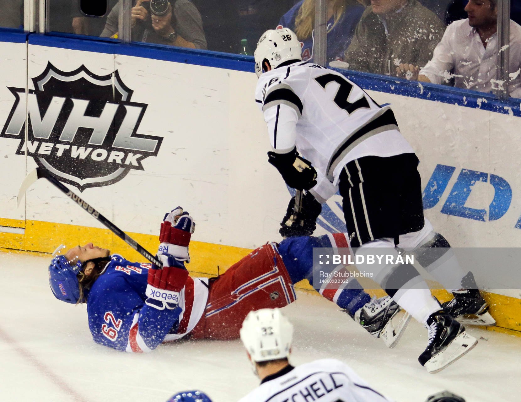New York Rangers left wing Carl Hagelin (62) is knocked to