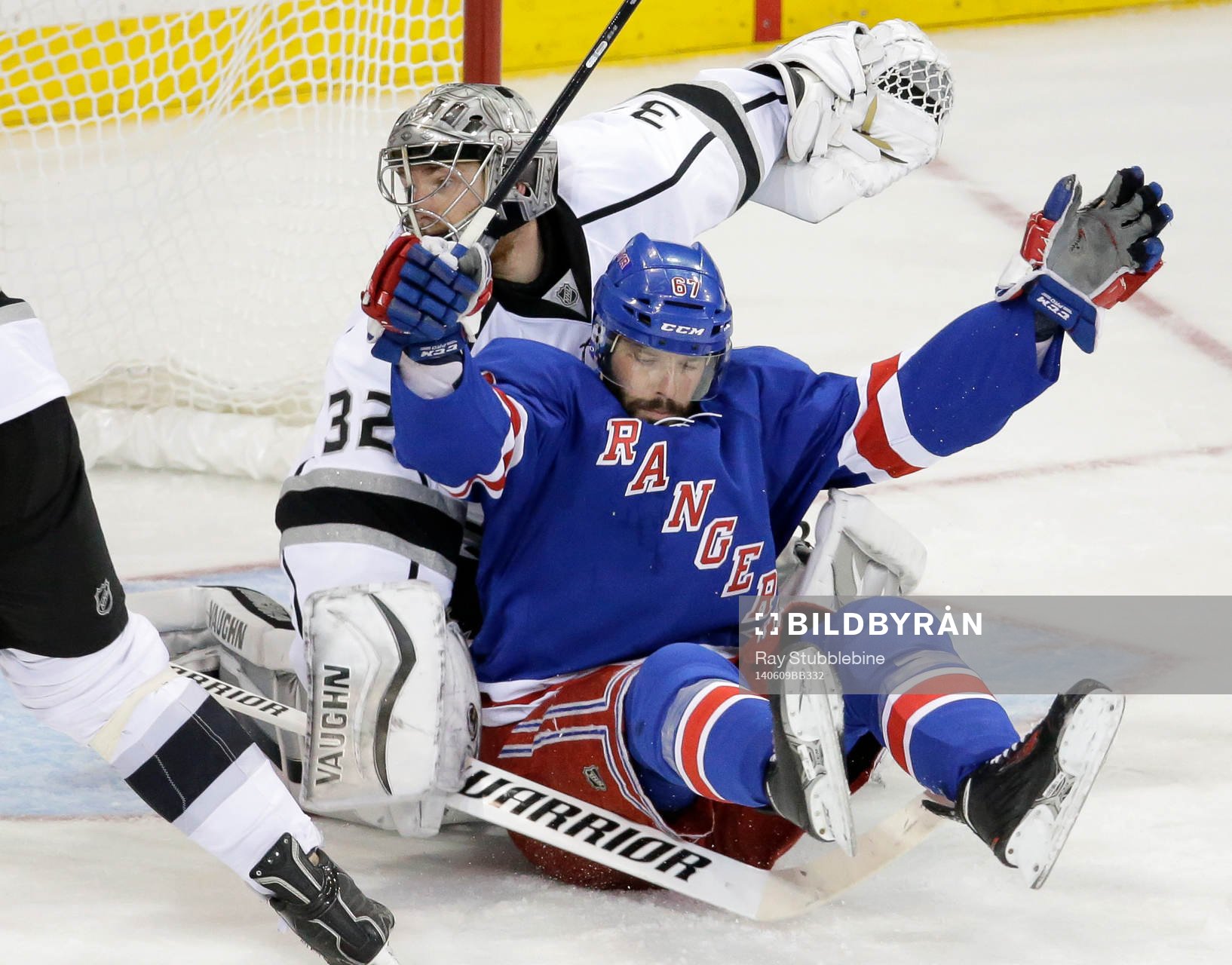 New York Rangers left wing Benoit Pouliot (67) crashes into