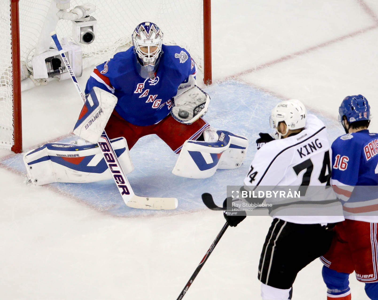 New York Rangers goalie Henrik Lundqvist (30) gloves a shot