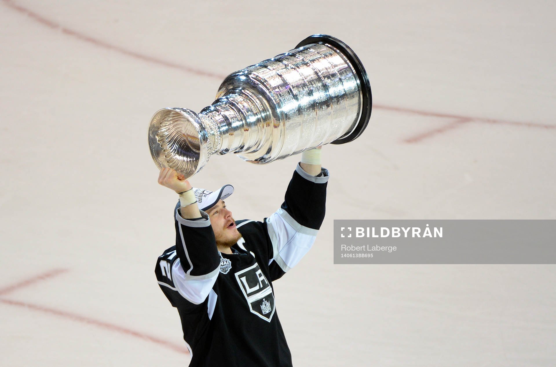 Dustin Brown of the Los Angeles Kings lifts the Stanley Cup