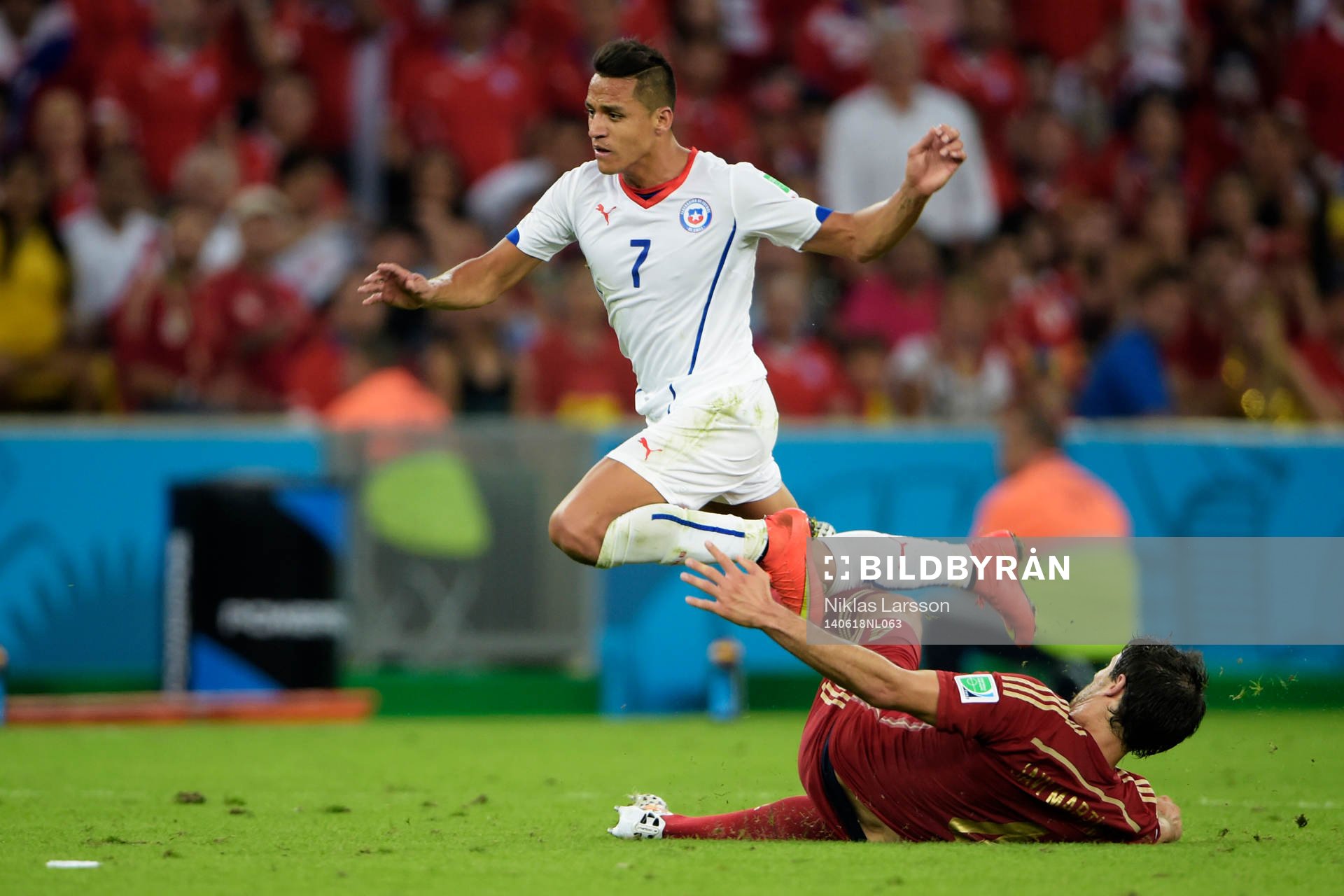 Chiles Alexis Sánchez och Spaniens Javi Martinez