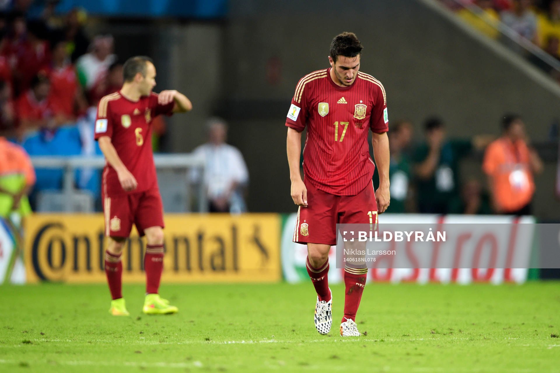Spaniens Andres Iniesta och Koke deppar
