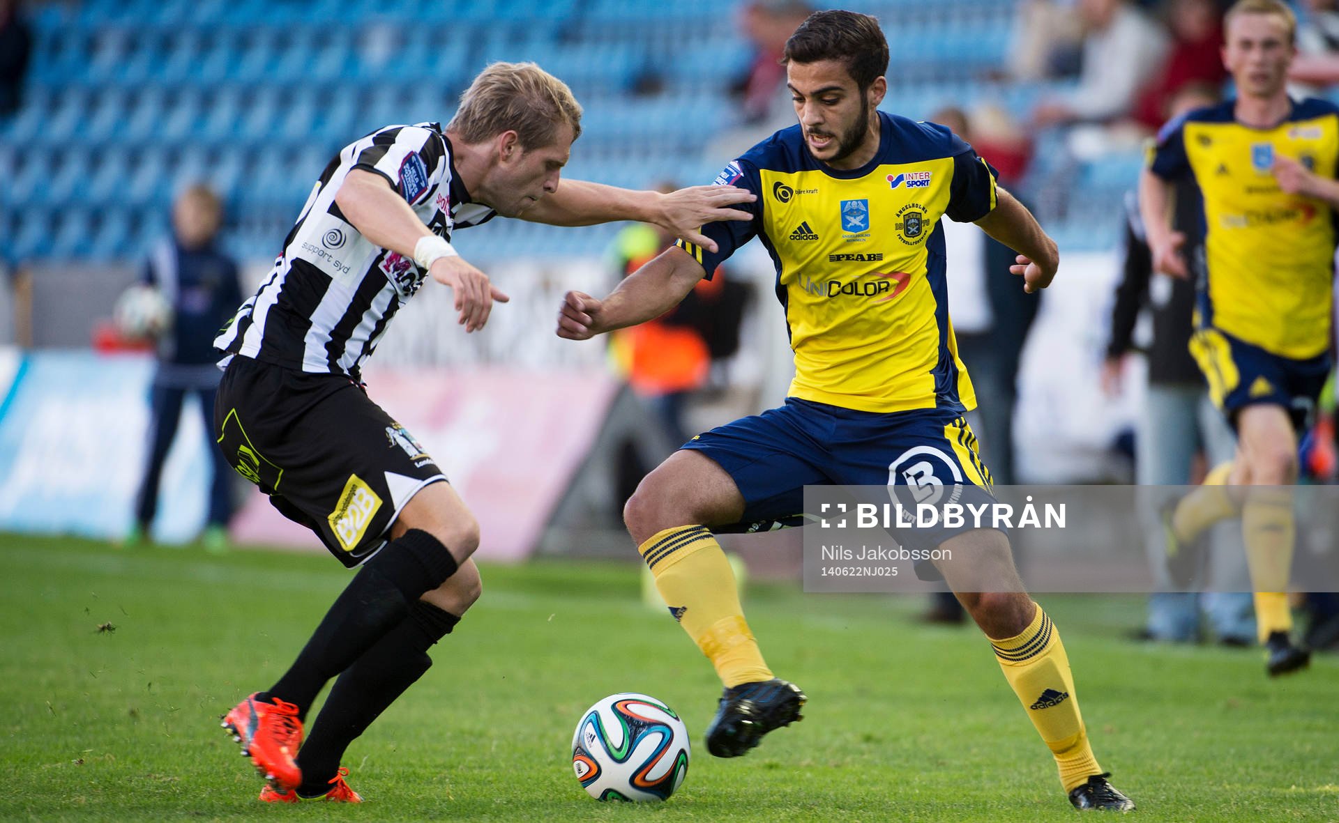 Landskronas Martin Rudolfsson och Ängelholms Otthman El Kabir under fotbollsmatchen i superettan mellan Landskrona BOIS och Ängelholm den 22 juni 2014.